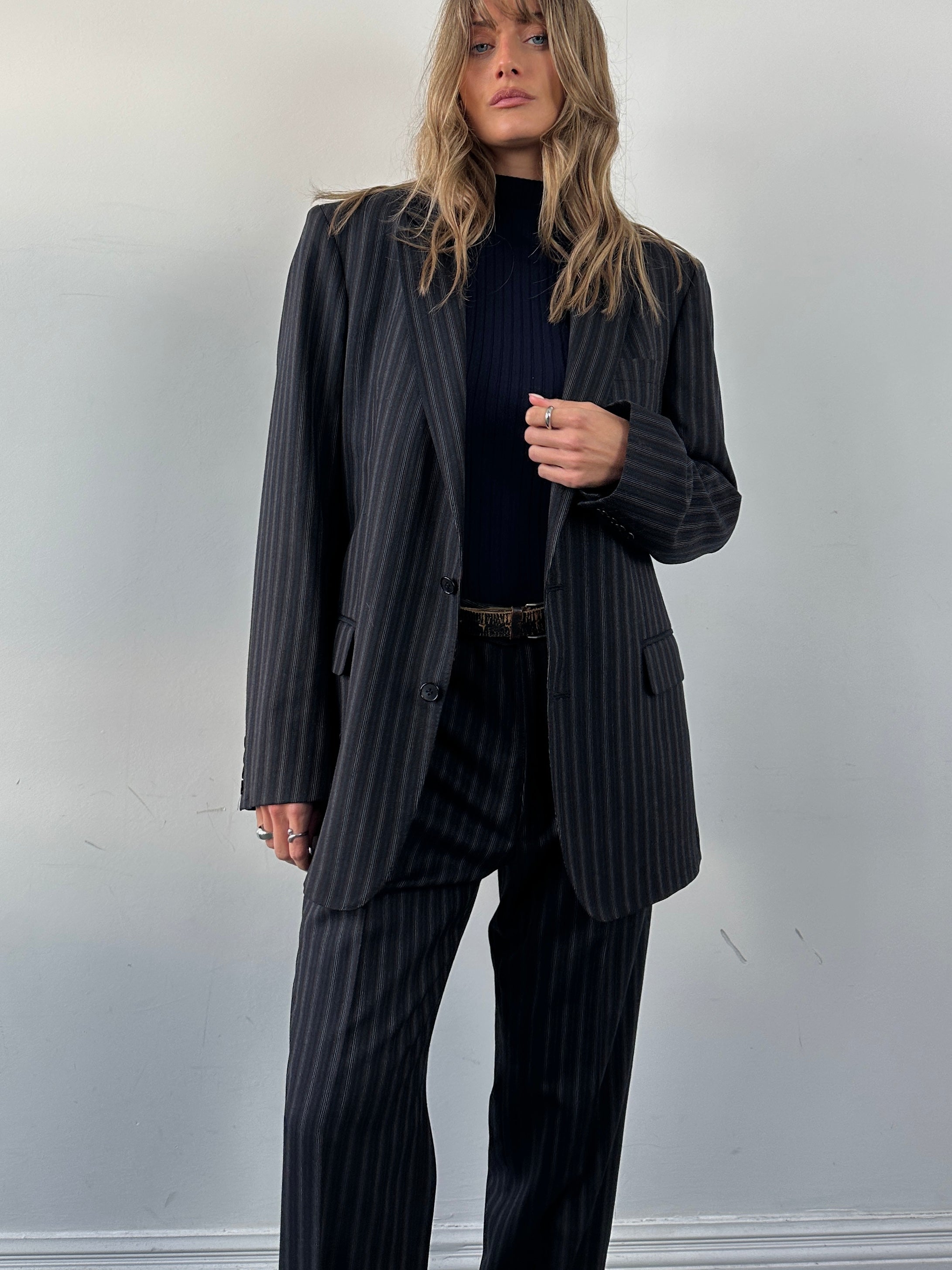 Christian Dior pure wool pinstripe suit jumpsuit in size 42L/W34, featuring tailored fit and classic pinstripe pattern.