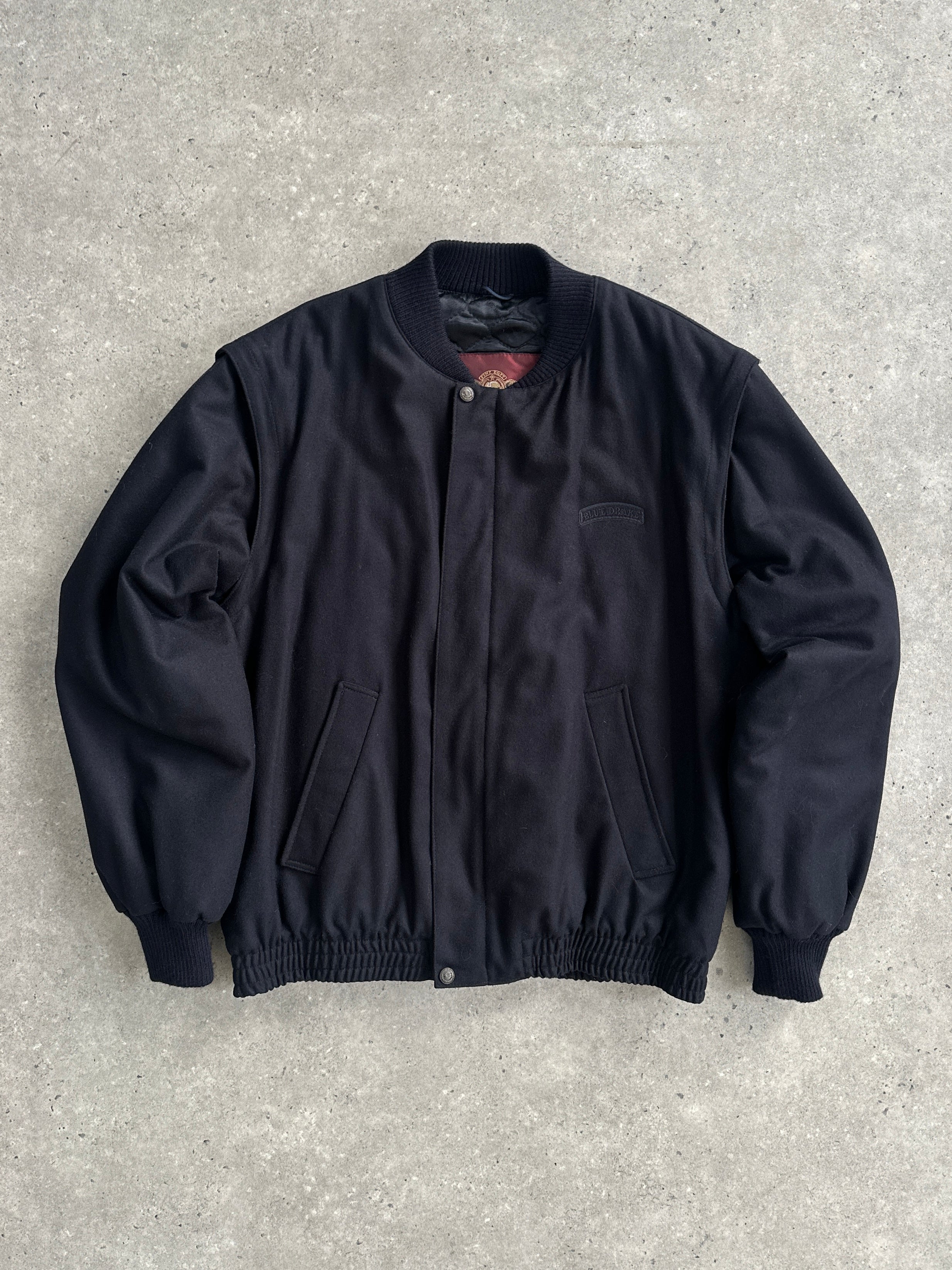 Vintage Italian wool bomber jacket in size L, featuring classic design and warm wool fabric with ribbed cuffs and collar.