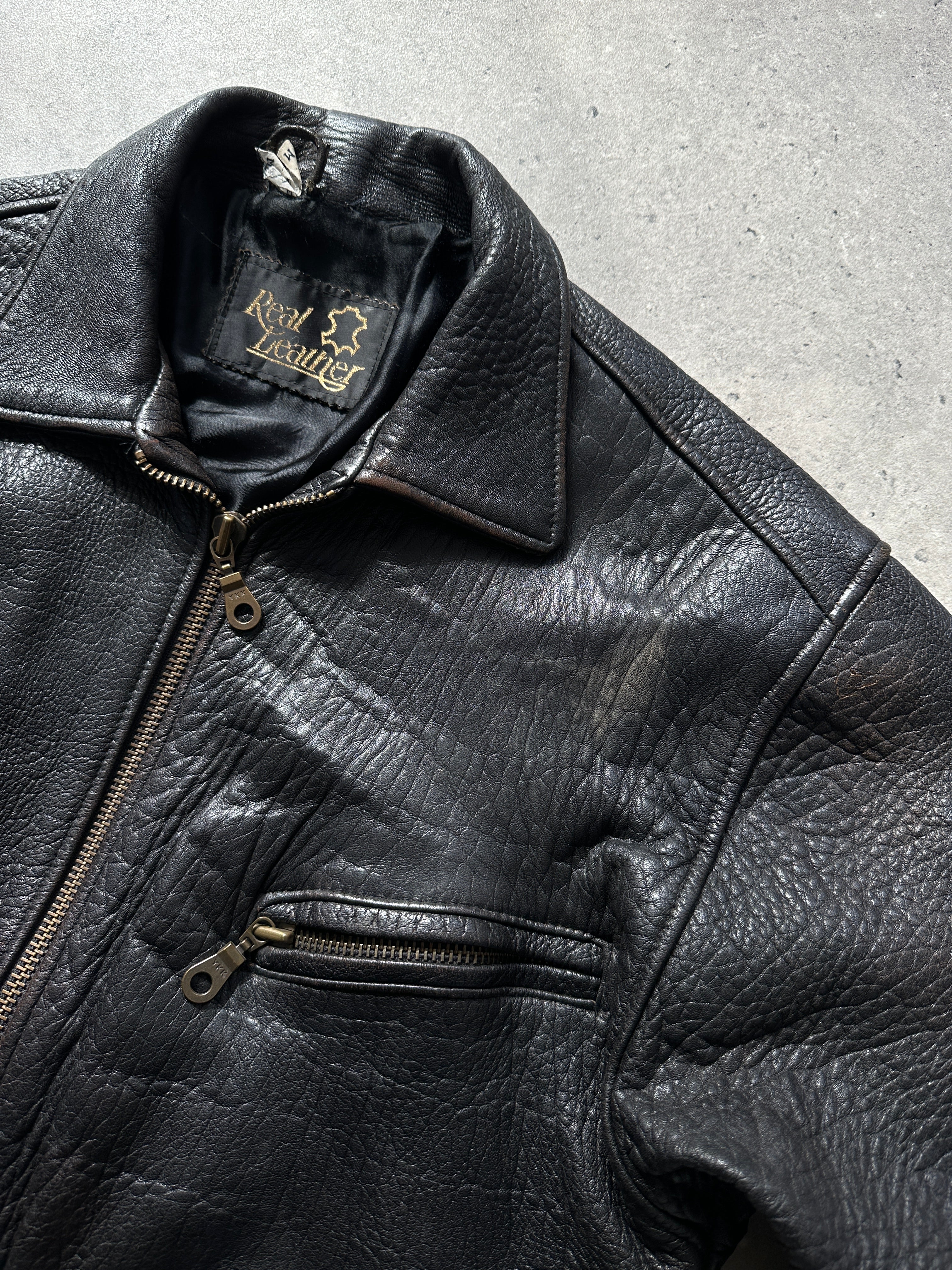British Vintage leather bomber jacket in medium size, featuring classic design and distressed leather finish.