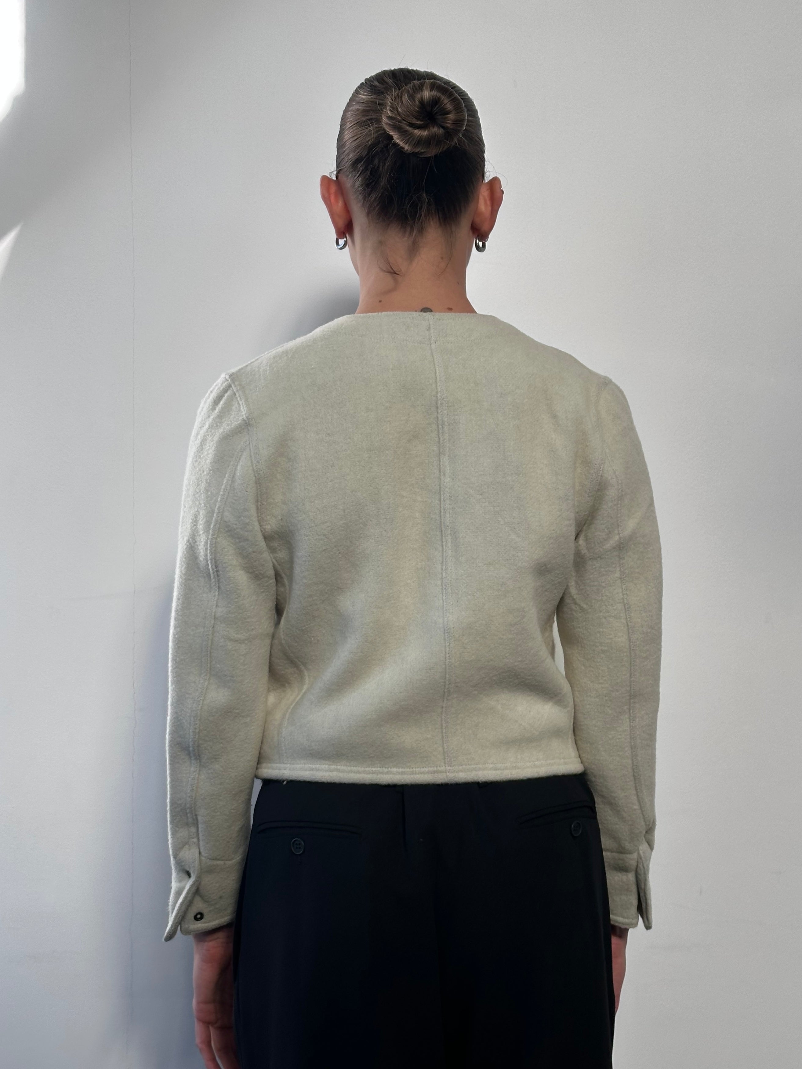 Vintage Italian vintage wool tailored jacket in size small, featuring classic design and textured fabric.