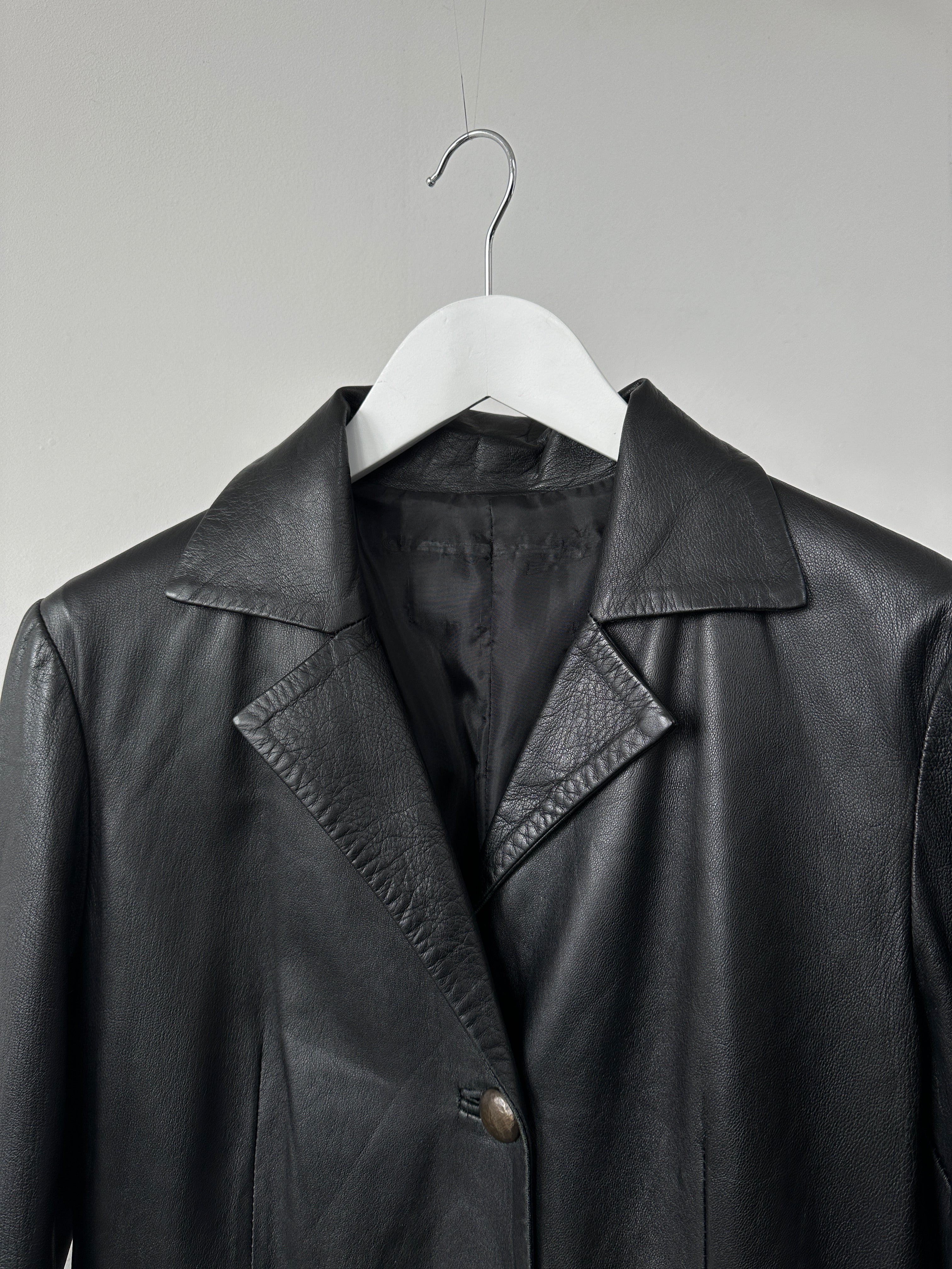 Italian vintage longline leather jacket by Vintage, smooth brown leather with a sleek, tailored fit, long sleeves, and classic design.