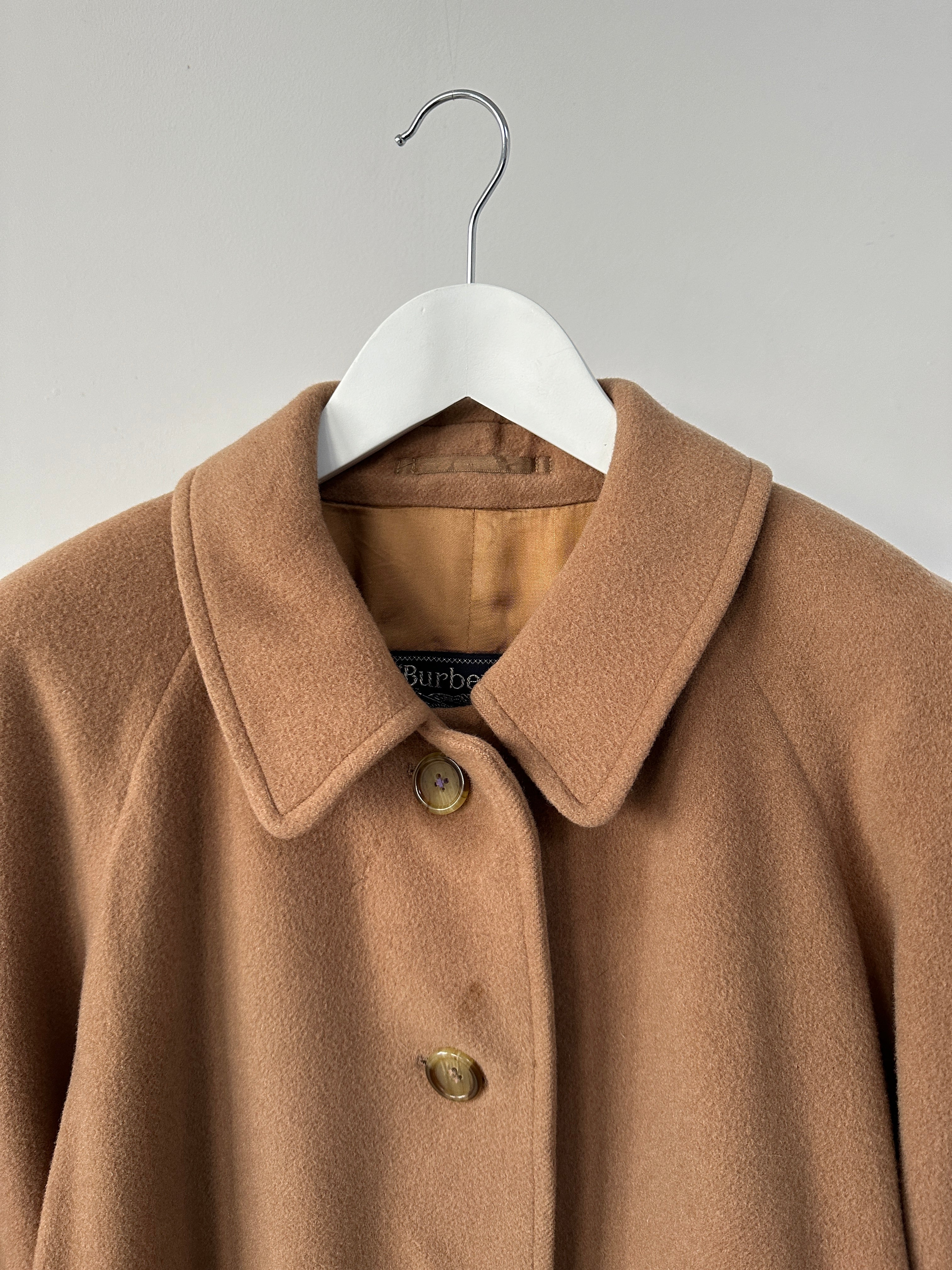 Burberry wool camel hair single-breasted coat in size L, featuring classic tailored design and elegant button details.