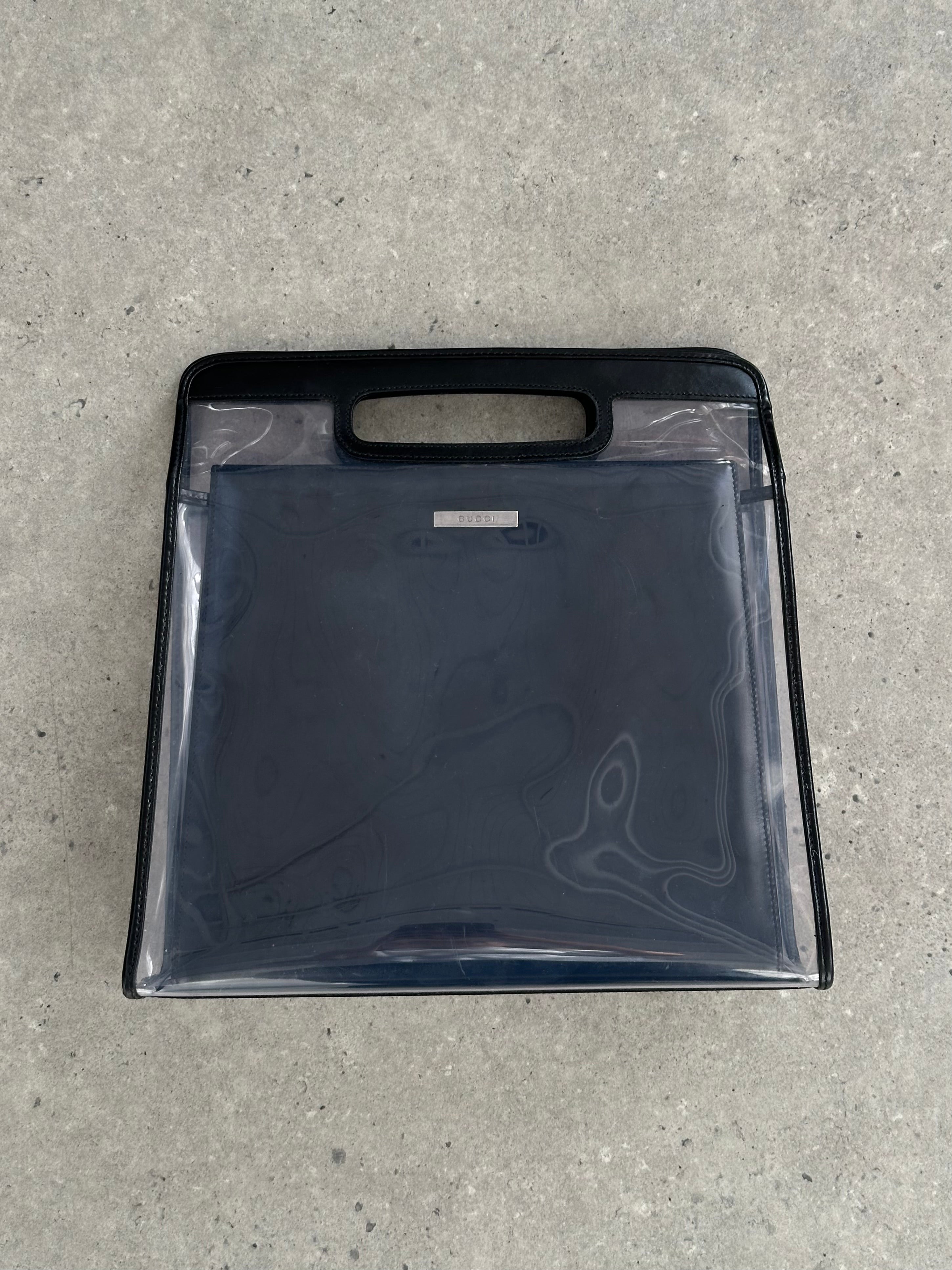 Gucci 1990s Tom Ford 2-in-1 leather and vinyl handbag with top handles and sleek design, showcasing a luxurious vintage style.