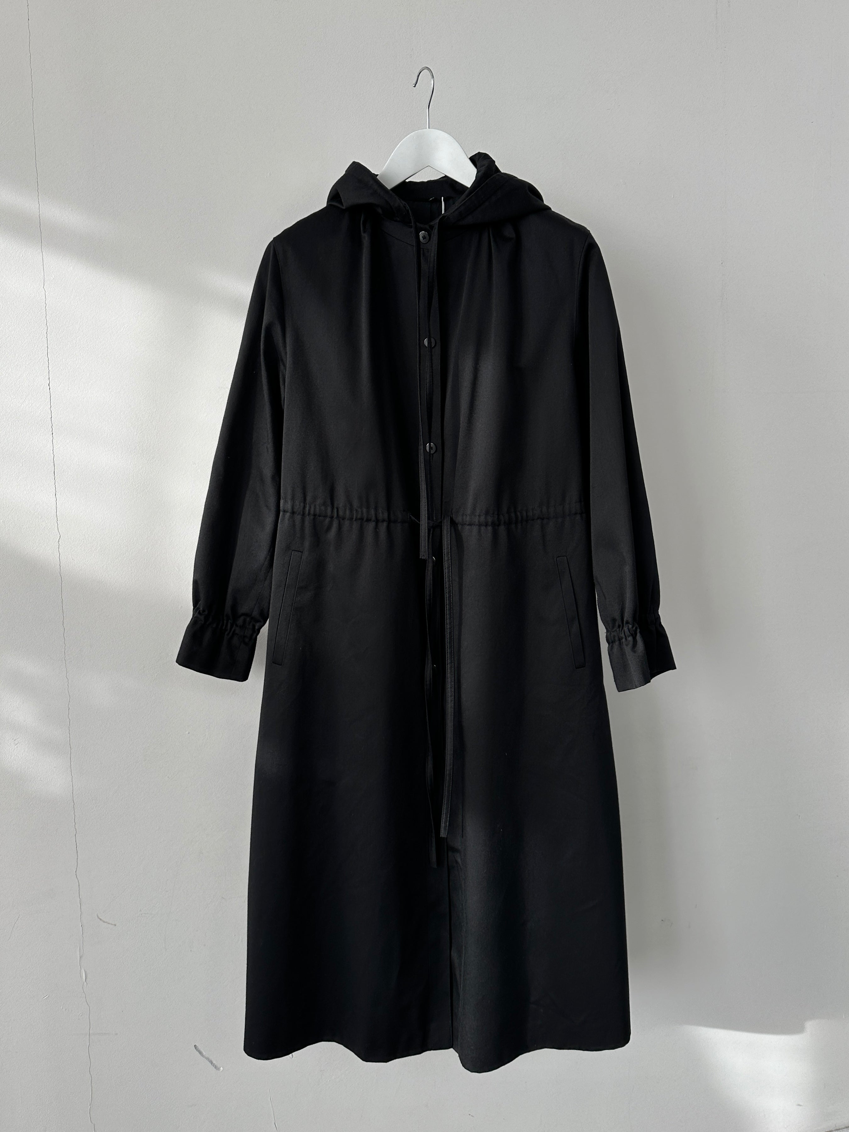 Vintage cotton tie waist hooded trench coat in size small, featuring a classic design and lightweight fabric.