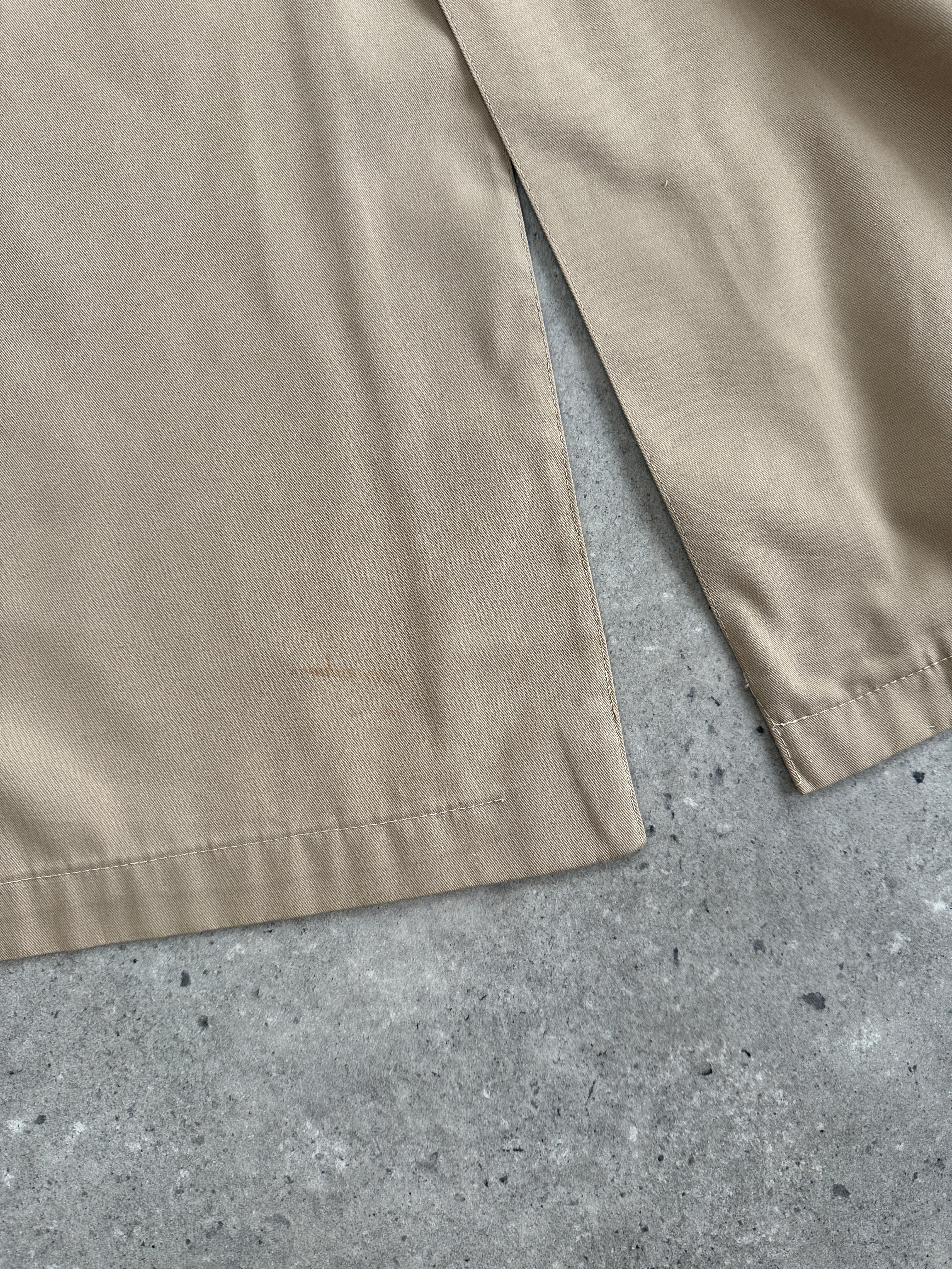 Vintage Italian cotton single-breasted trench coat in size small, showcasing classic design and timeless style.