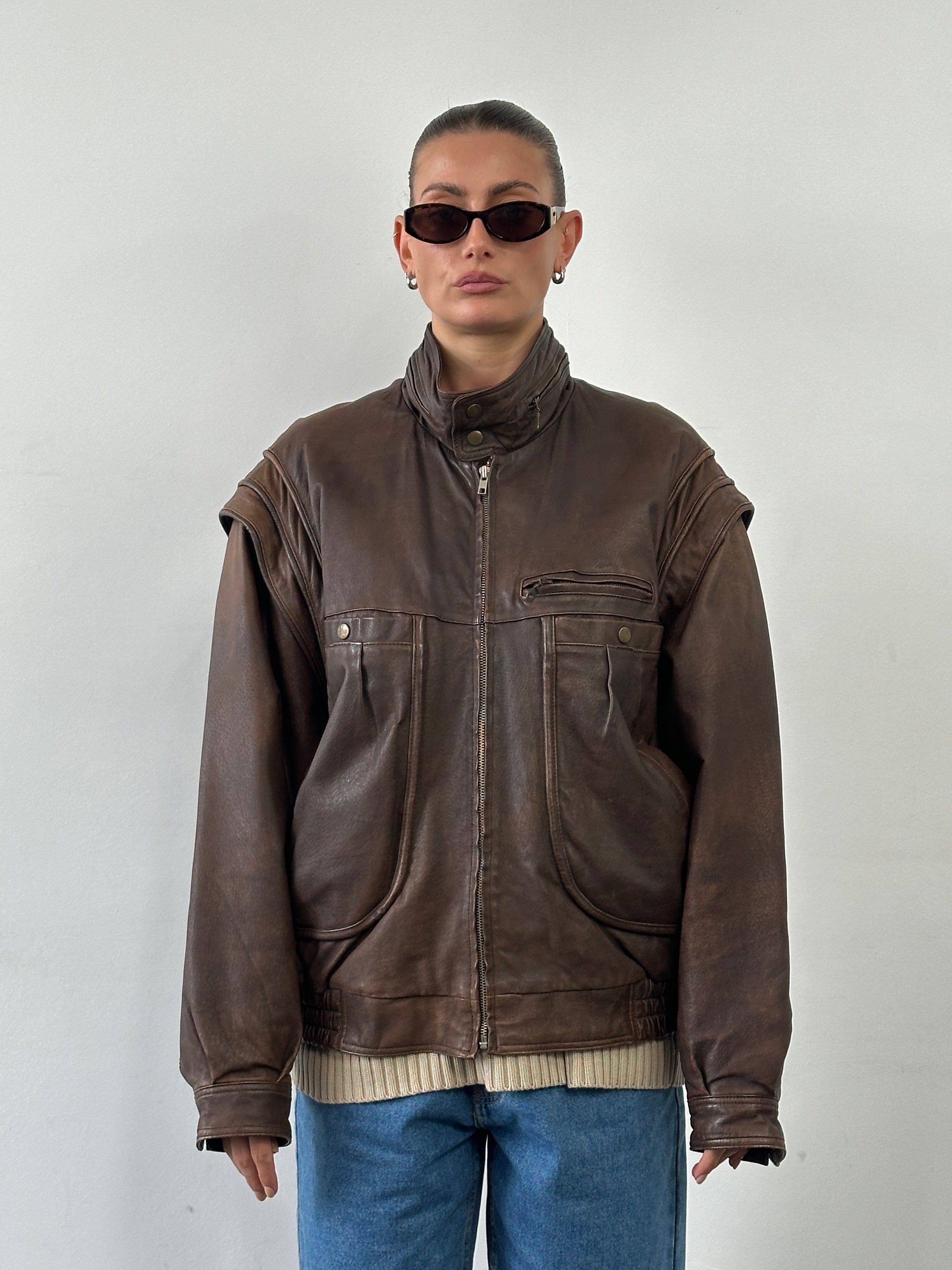 Vintage high-neck aged leather bomber jacket, size L/XL, featuring a classic design and distressed leather finish.