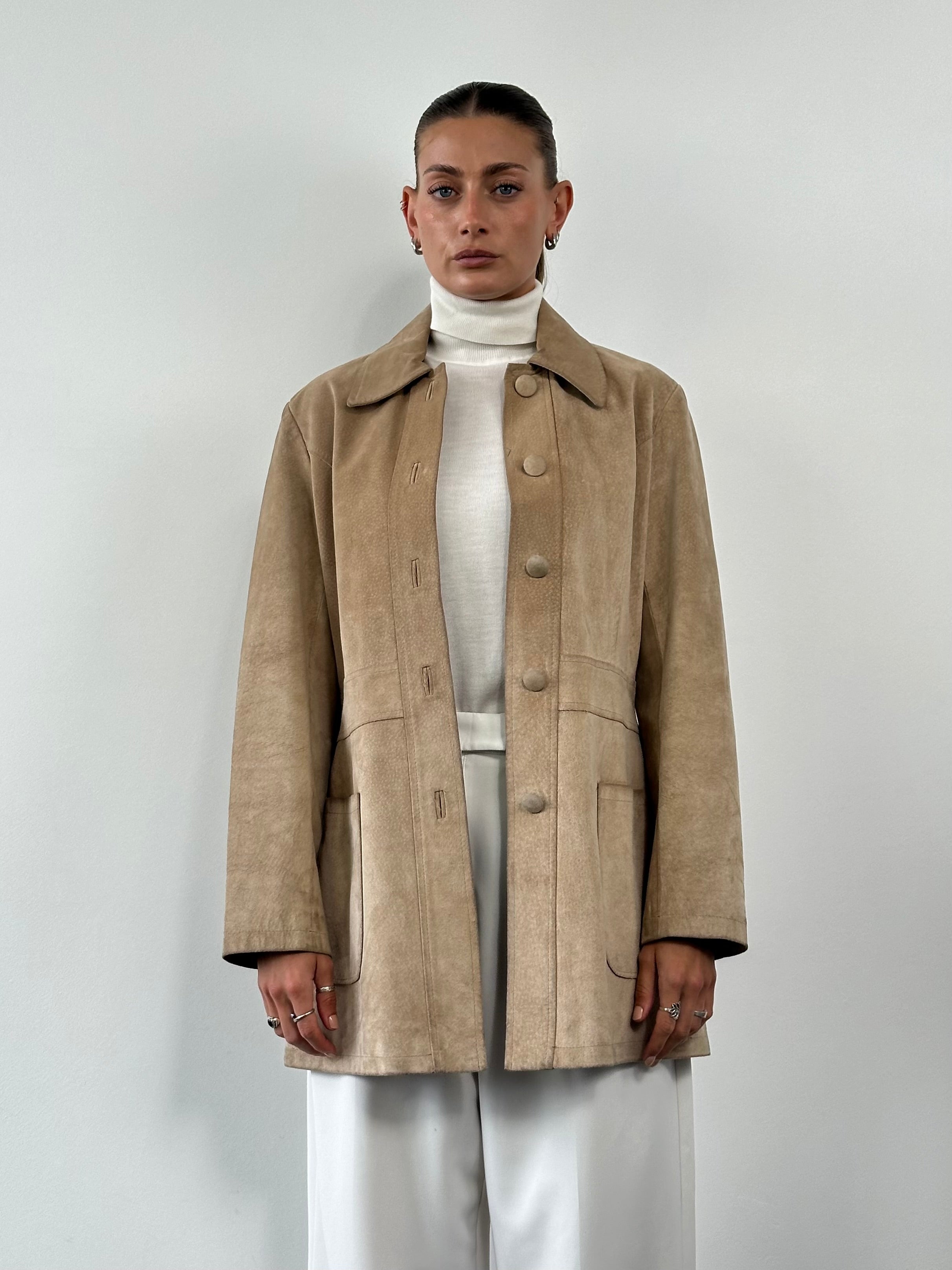 Vintage suede jacket in size M/L, featuring classic style and soft texture, displayed on a hanger.