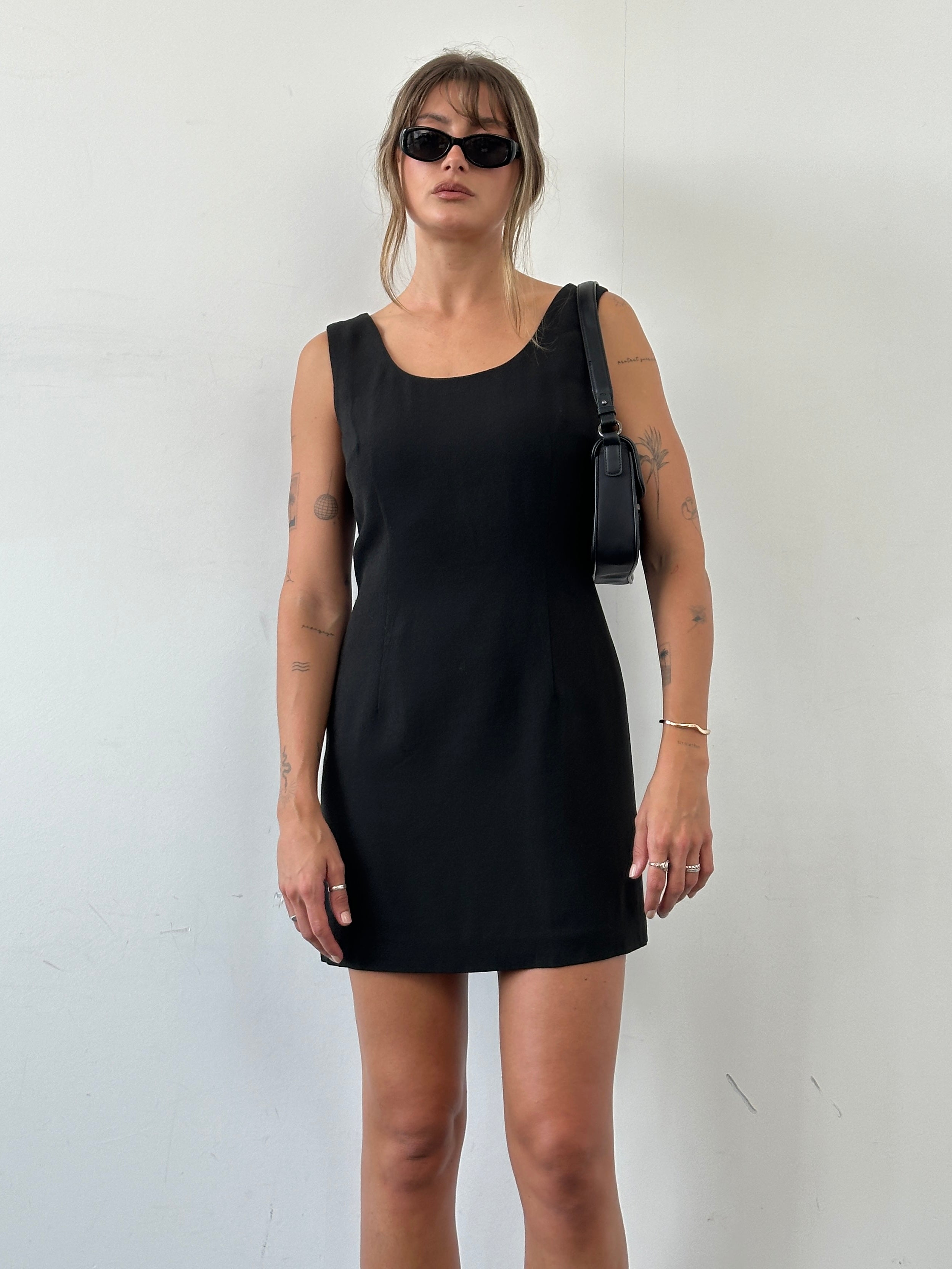 Dolce & Gabbana fitted mini dress in vibrant fabric, close-up of the stylish silhouette and elegant design details.