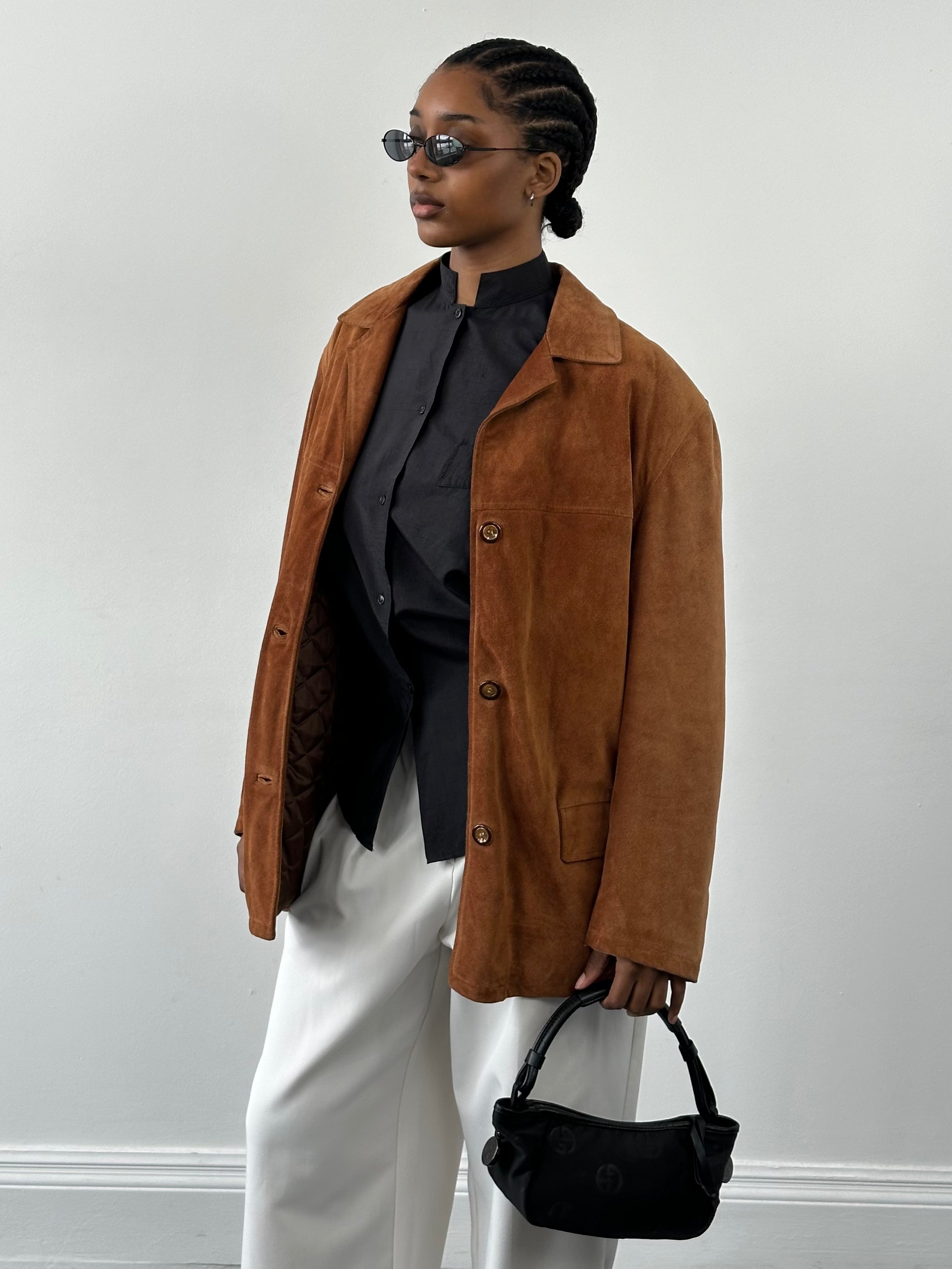 Vintage Italian 1990s suede leather jacket, size L, with classic distressed texture and vintage style details.
