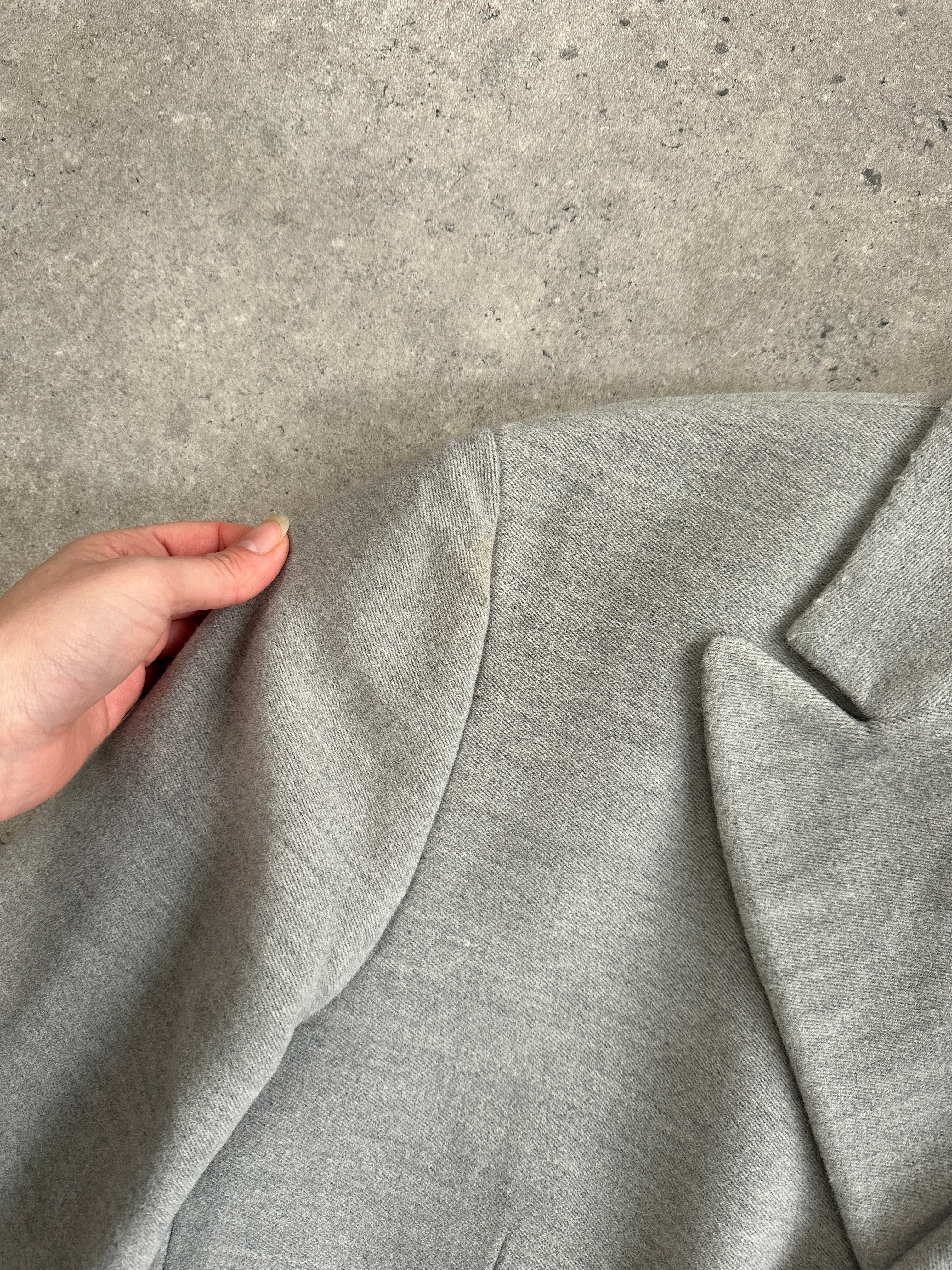 Gianfranco Ferre 1990s wool single-breasted coat in size L, shown hanging with detailed front view and classic design.