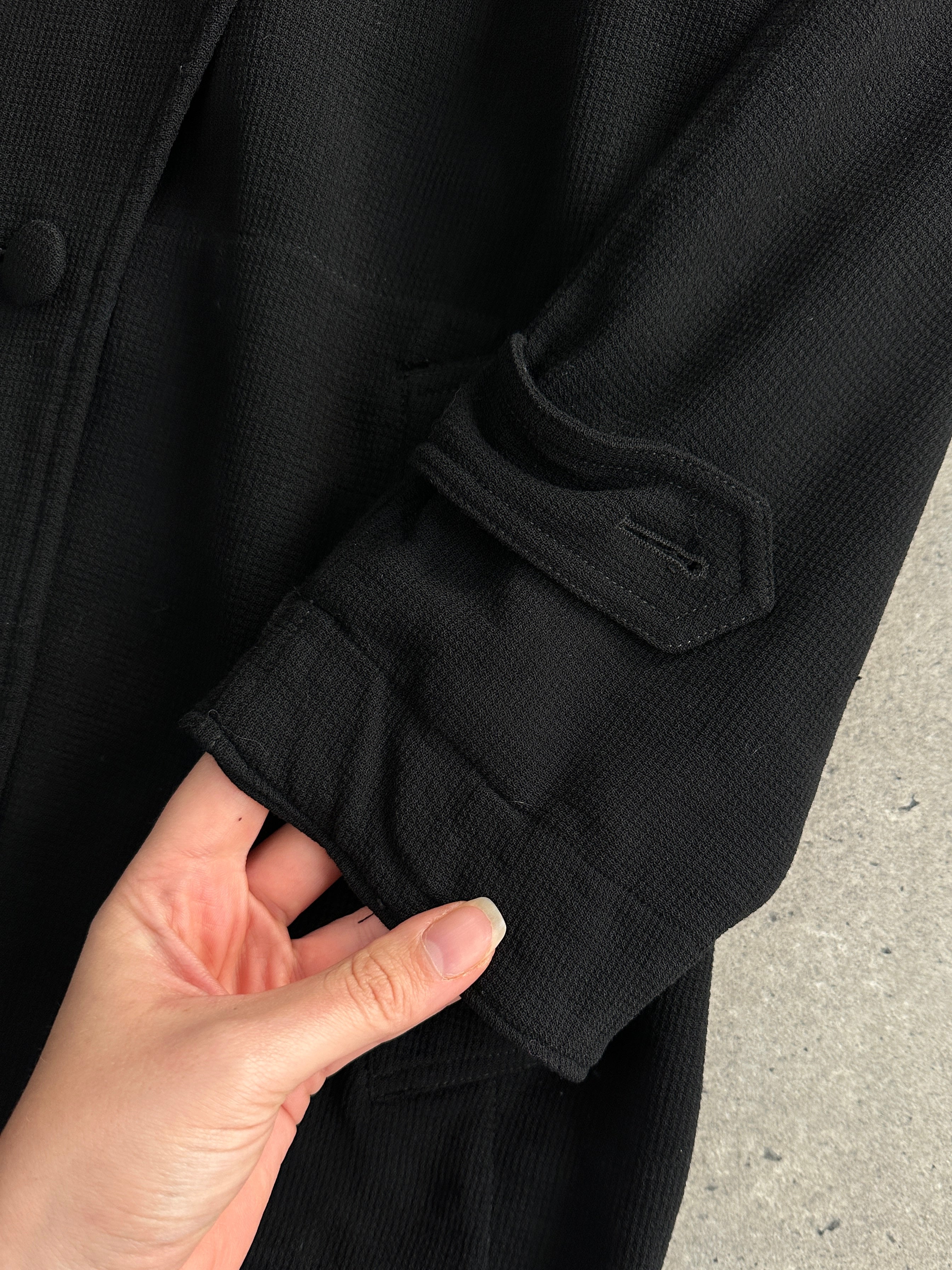 Moschino Couture 1990s pure wool double-breasted curved coat in size L, featuring classic design and tailored fit.