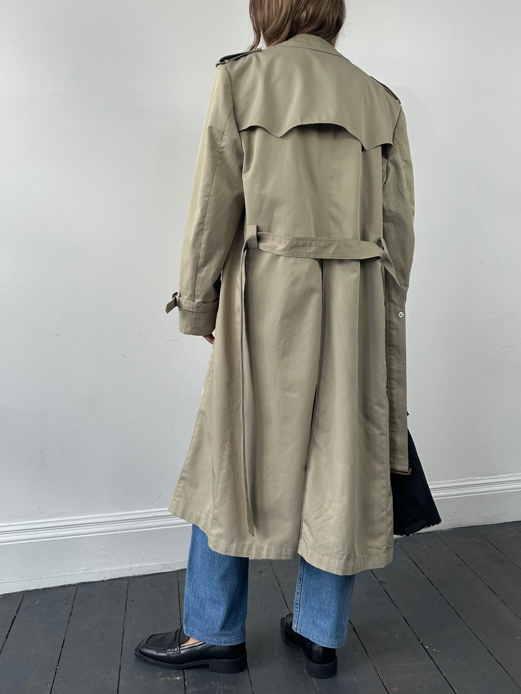 Christian Dior double-breasted belted trench coat in XL, showcasing classic beige fabric, lapel collar, and stylish button details.