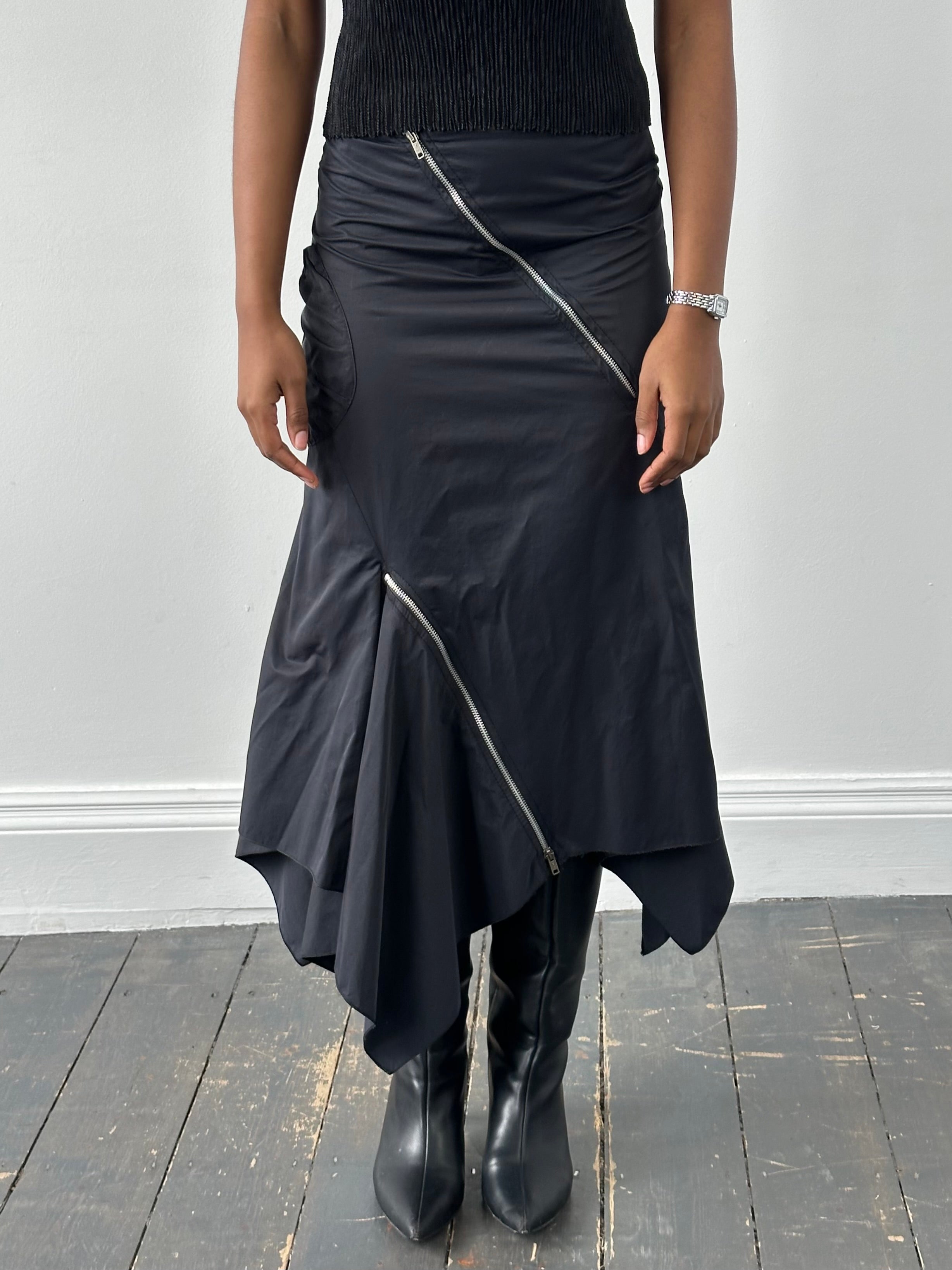 Vintage 1990s cotton multi-zip ruffle skirt in size W28, featuring colorful layered ruffles and a retro style.