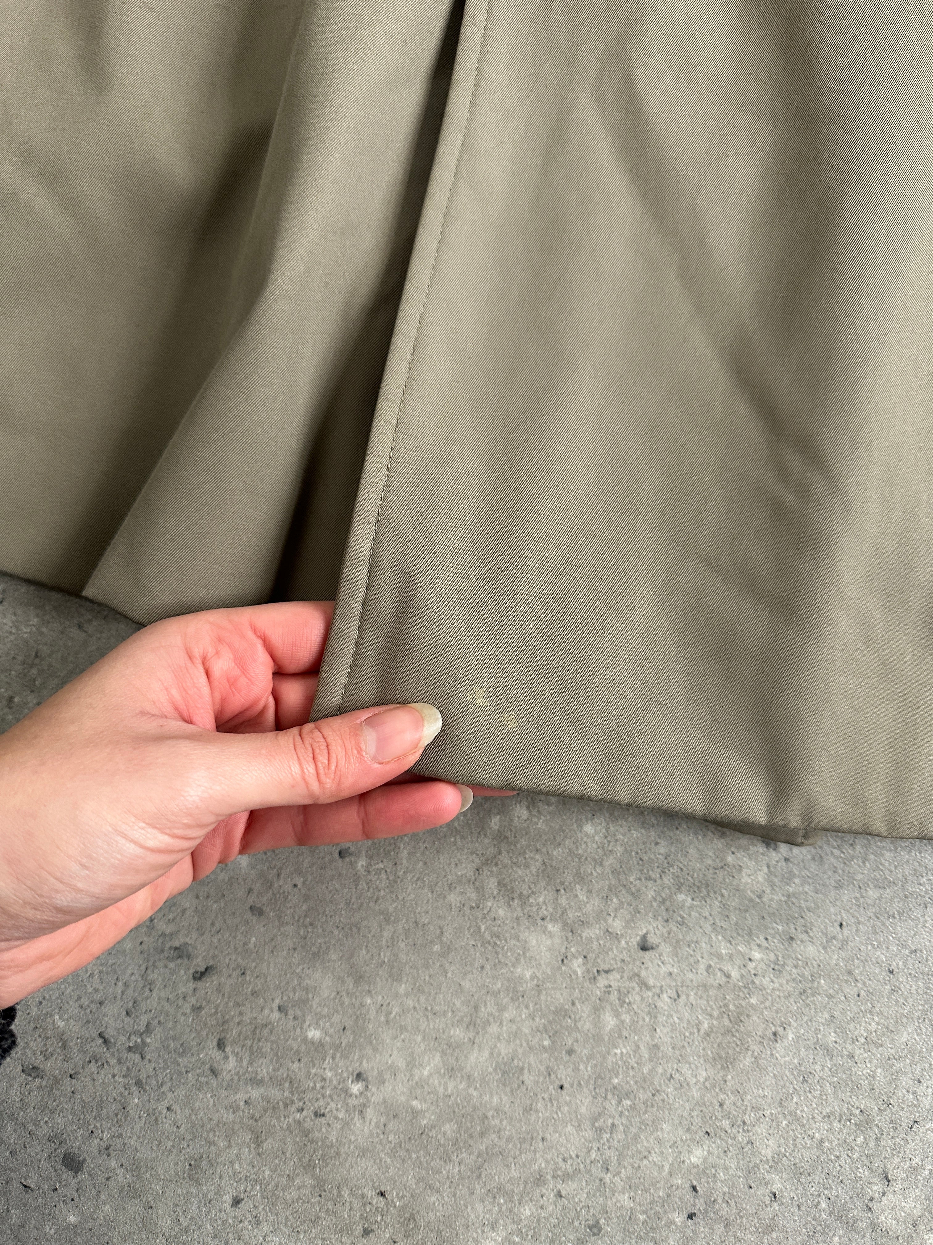 Aquascutum pure cotton double-breasted belted trench coat in XL displayed on a hanger, classic beige color with lapel collar