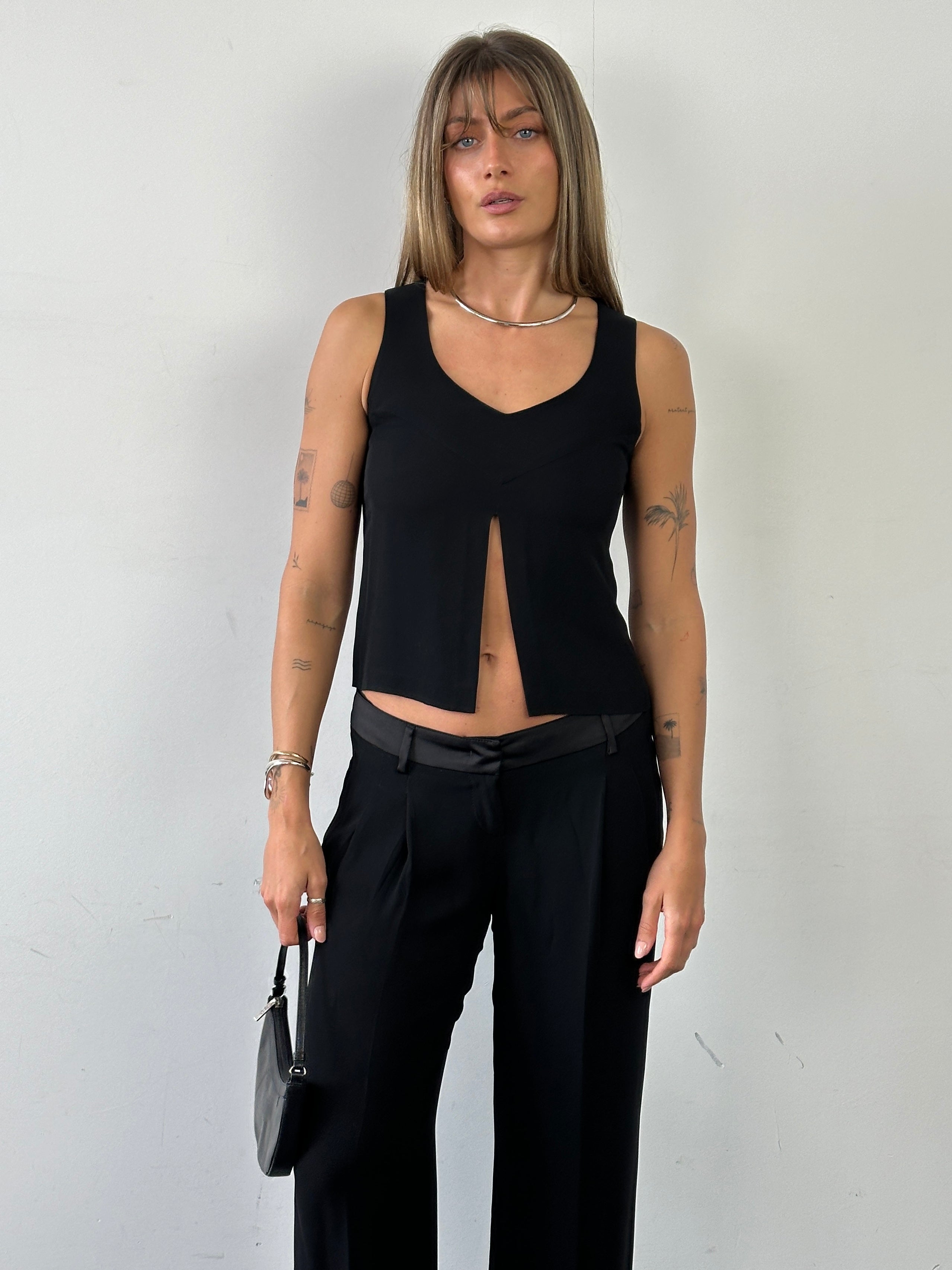 Emporio Armani XS split front tank top in black, featuring a stylish front slit and sleeveless design.