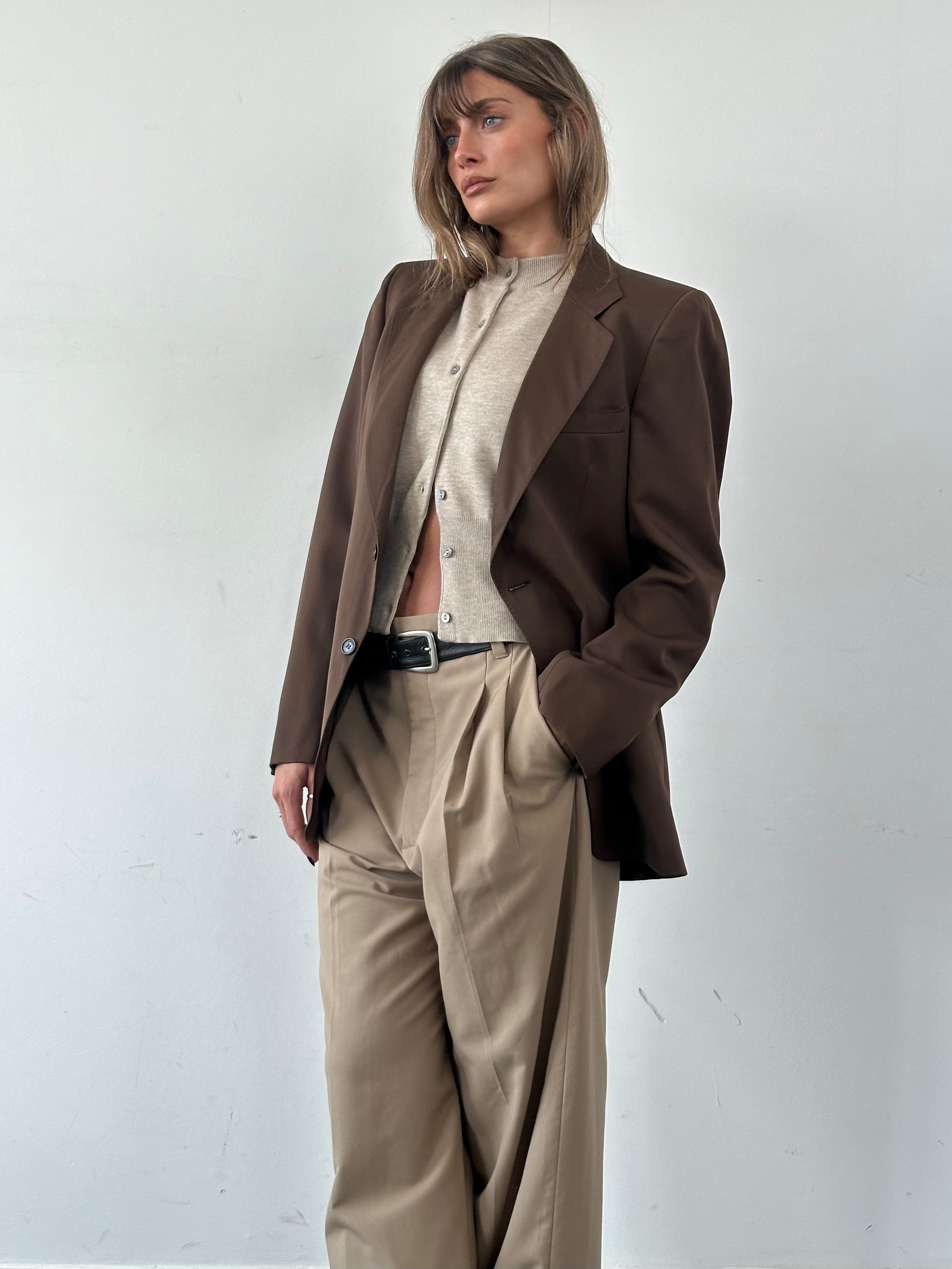 Vintage Italian pure wool single-breasted blazer in size S/M, showcasing classic tailored fit and timeless design.
