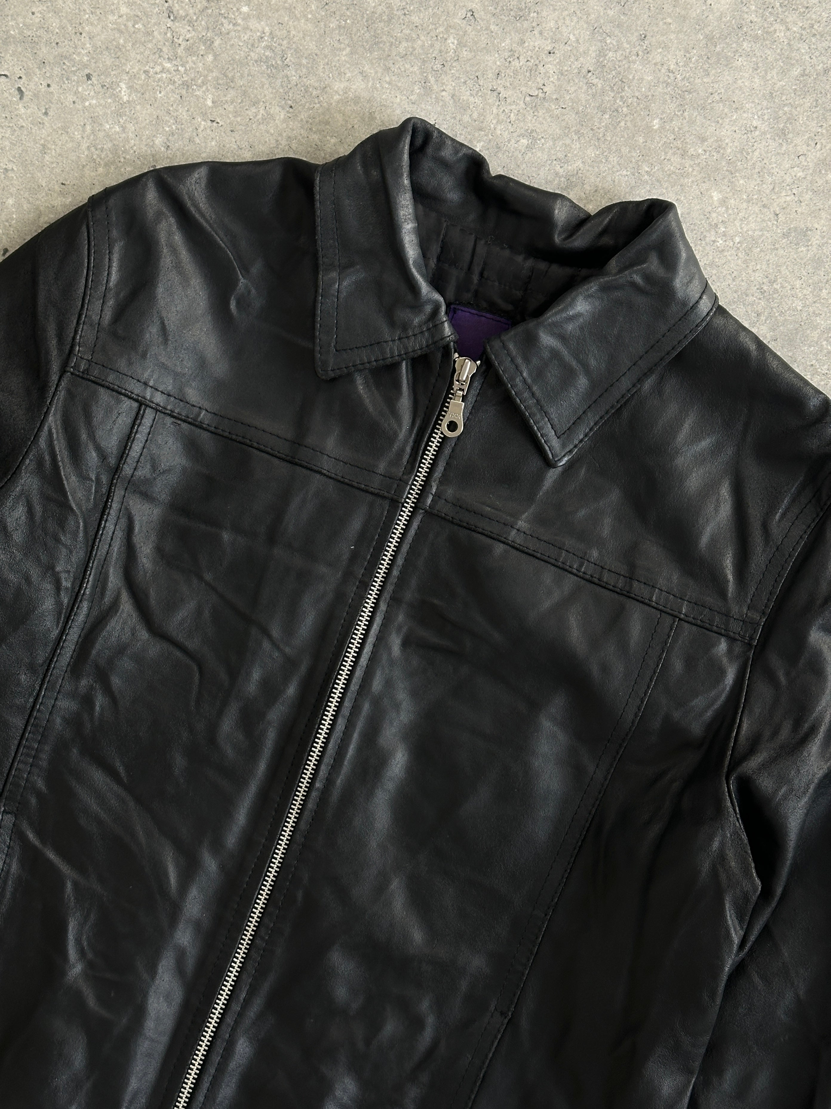 Vintage minimal zip-up leather jacket in size small, featuring a sleek design and classic leather texture.