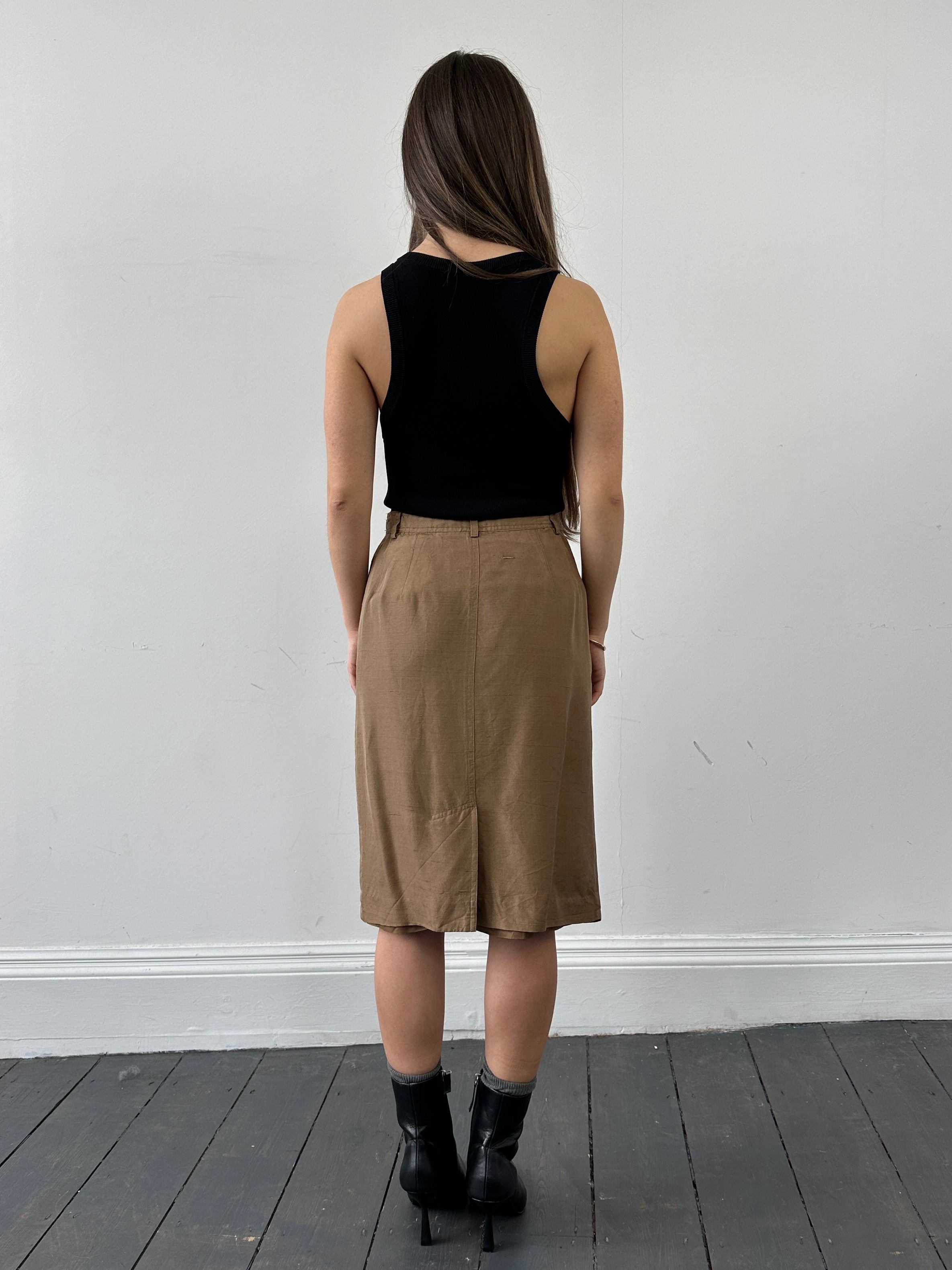 Jaeger pure silk button-down midi skirt in W24, featuring a sleek, flowing design with a classic button-front detail.