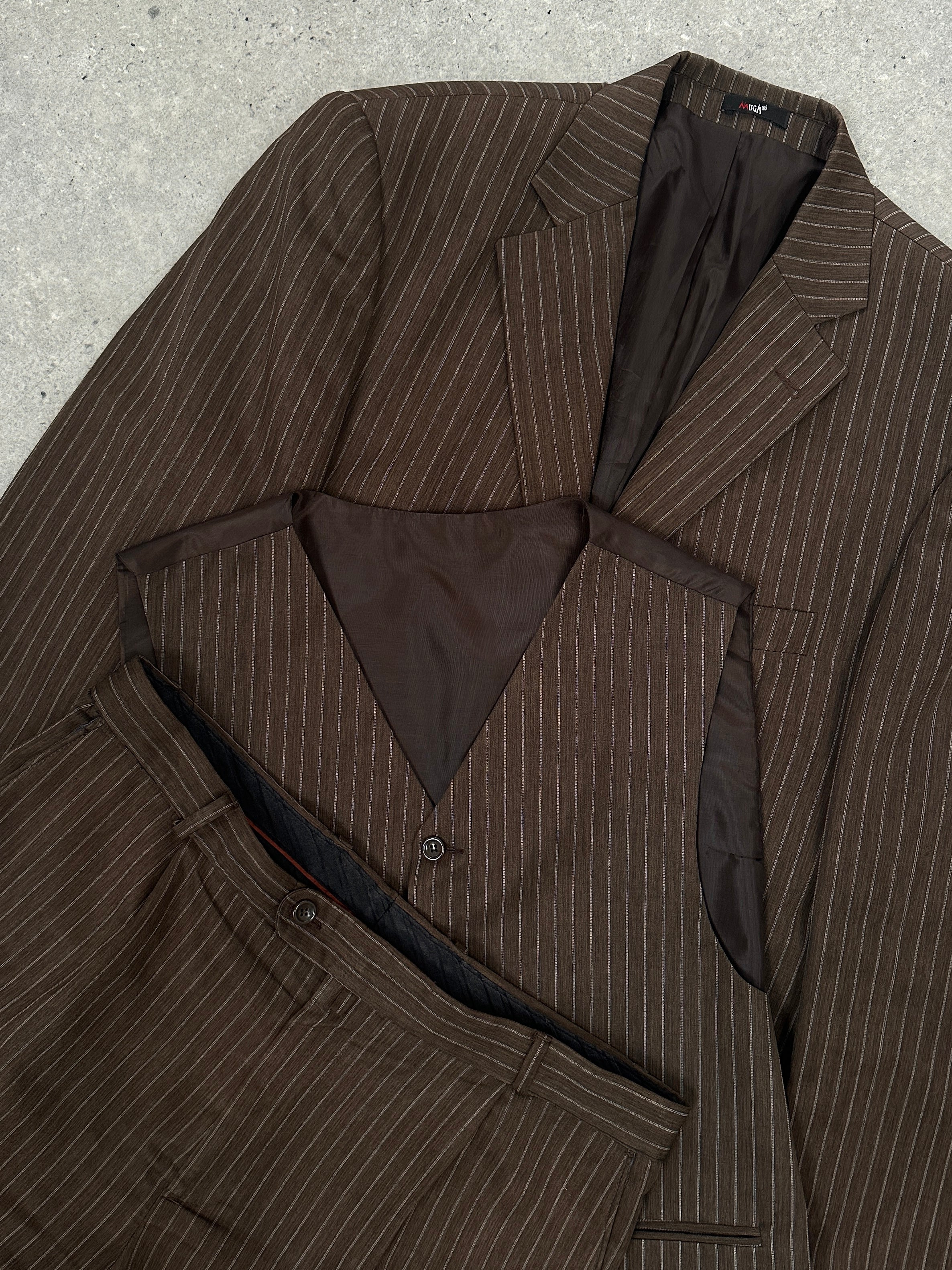 Vintage Italian three-piece suit in vintage wool with bold stripe pattern, displayed on a hanger. Size 44R/W34.