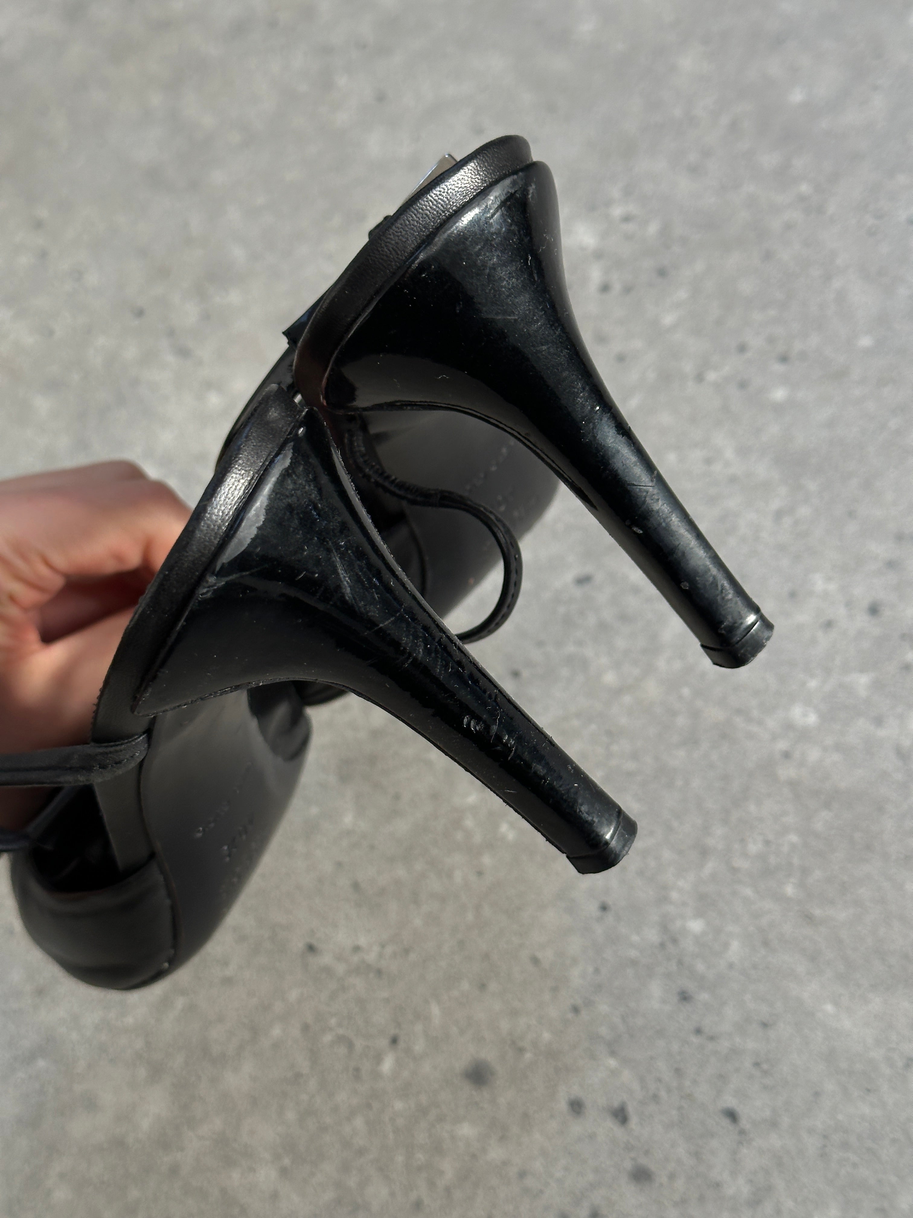 Prada pointed toe high heels in black leather, UK 7.5, EUR 40.5, with sleek stiletto heel and elegant design.