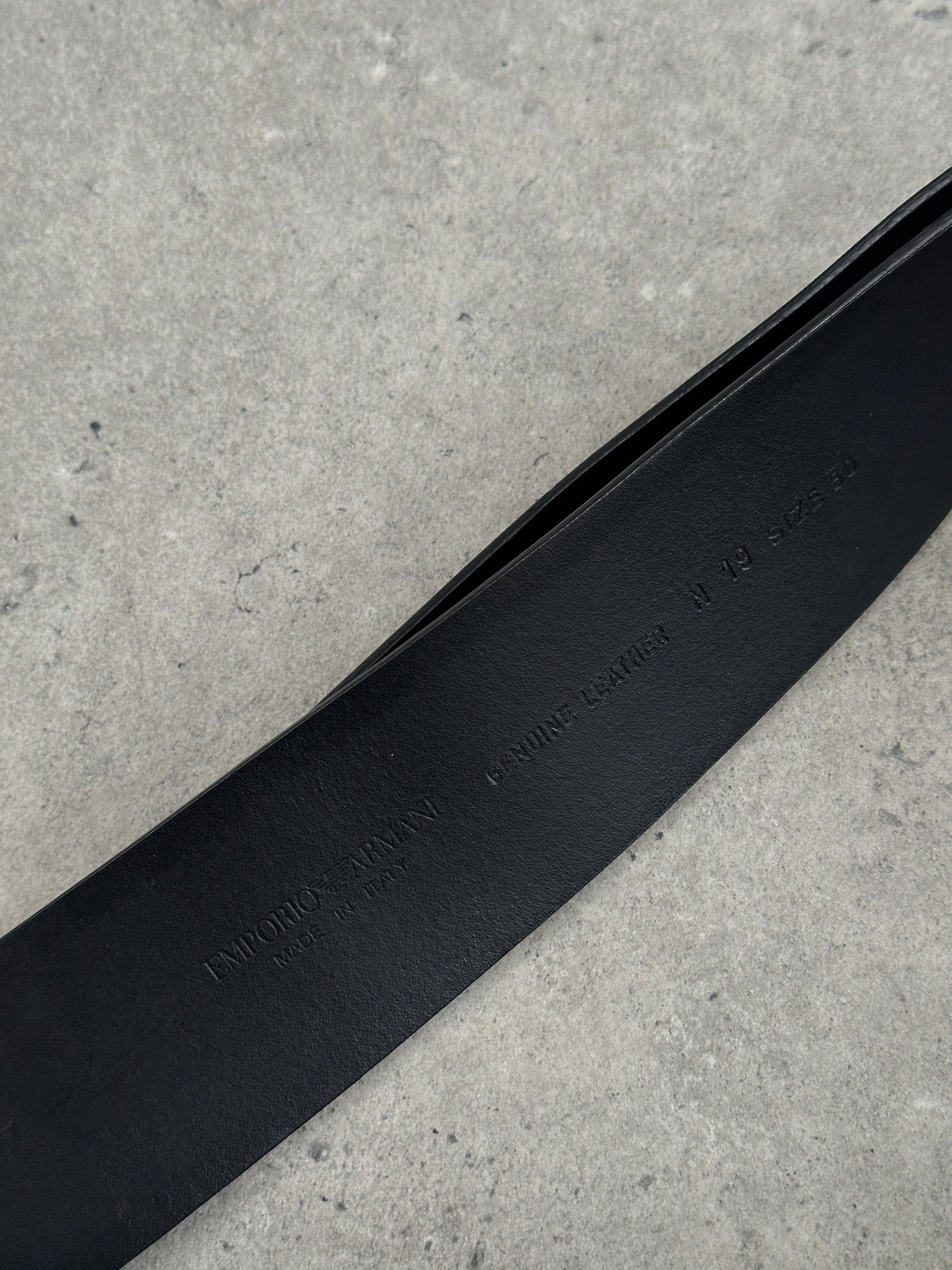 Emporio Armani leather belt with EA buckle, size W30–32, featuring classic design and high-quality craftsmanship.