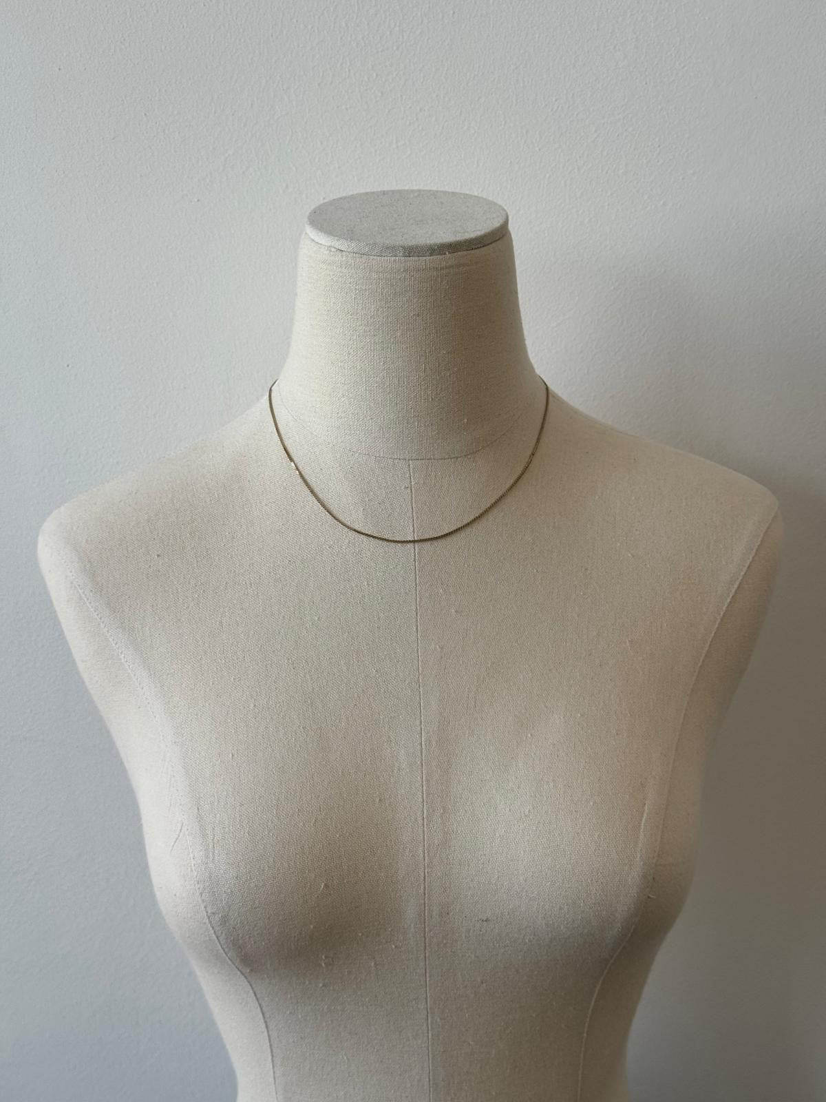 Pierre Cardin 1990s gold plated fine necklace with delicate chain and subtle shine, showcasing elegant vintage jewelry design.