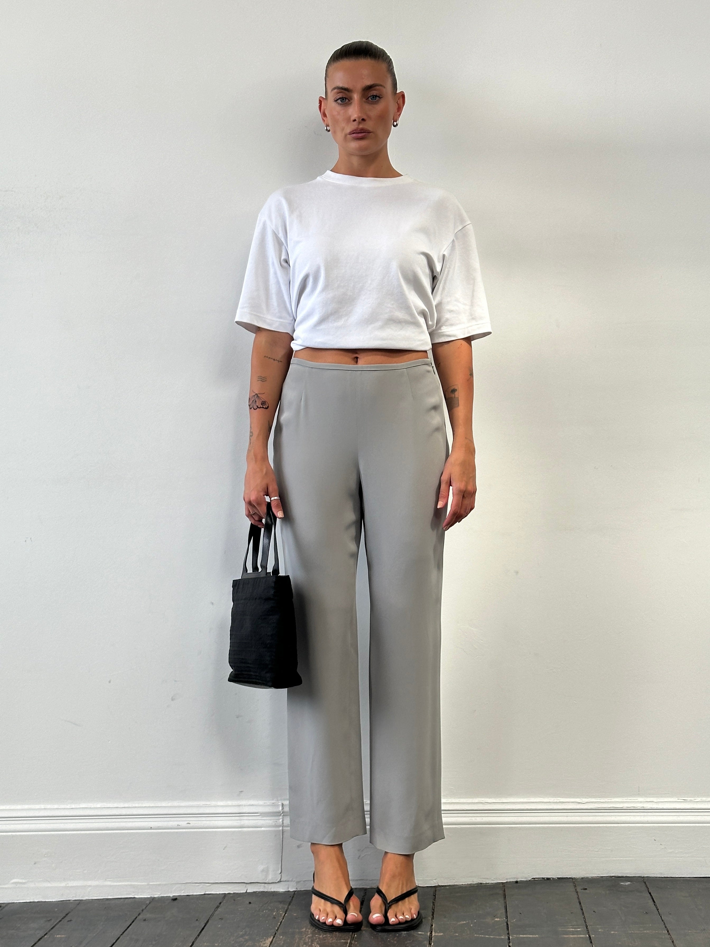Armani Collezioni relaxed high-waisted silk trousers in W28, showcasing smooth fabric and tailored fit.