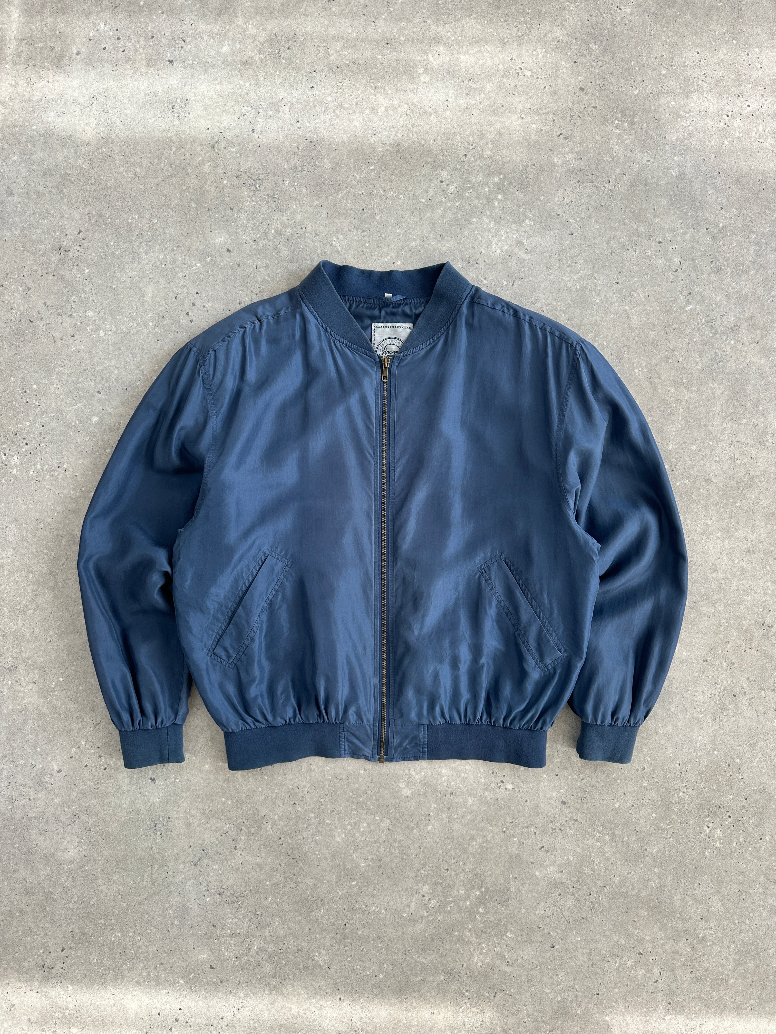 Vintage 90s pure silk bomber jacket in size large, featuring classic design and smooth satin finish.
