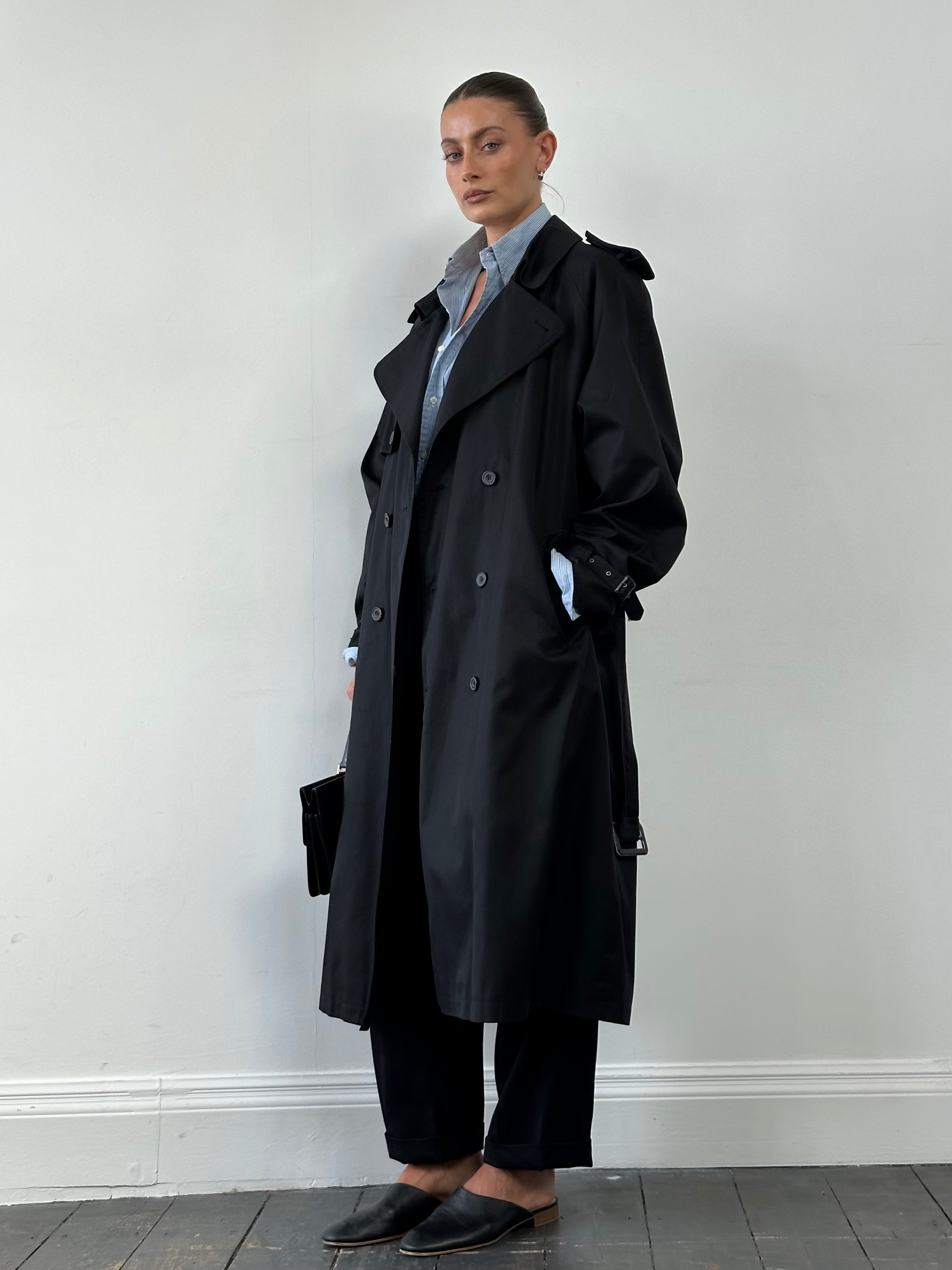 Vintage double-breasted belted trench coat in XL, featuring classic design and fabric details visible in the image.