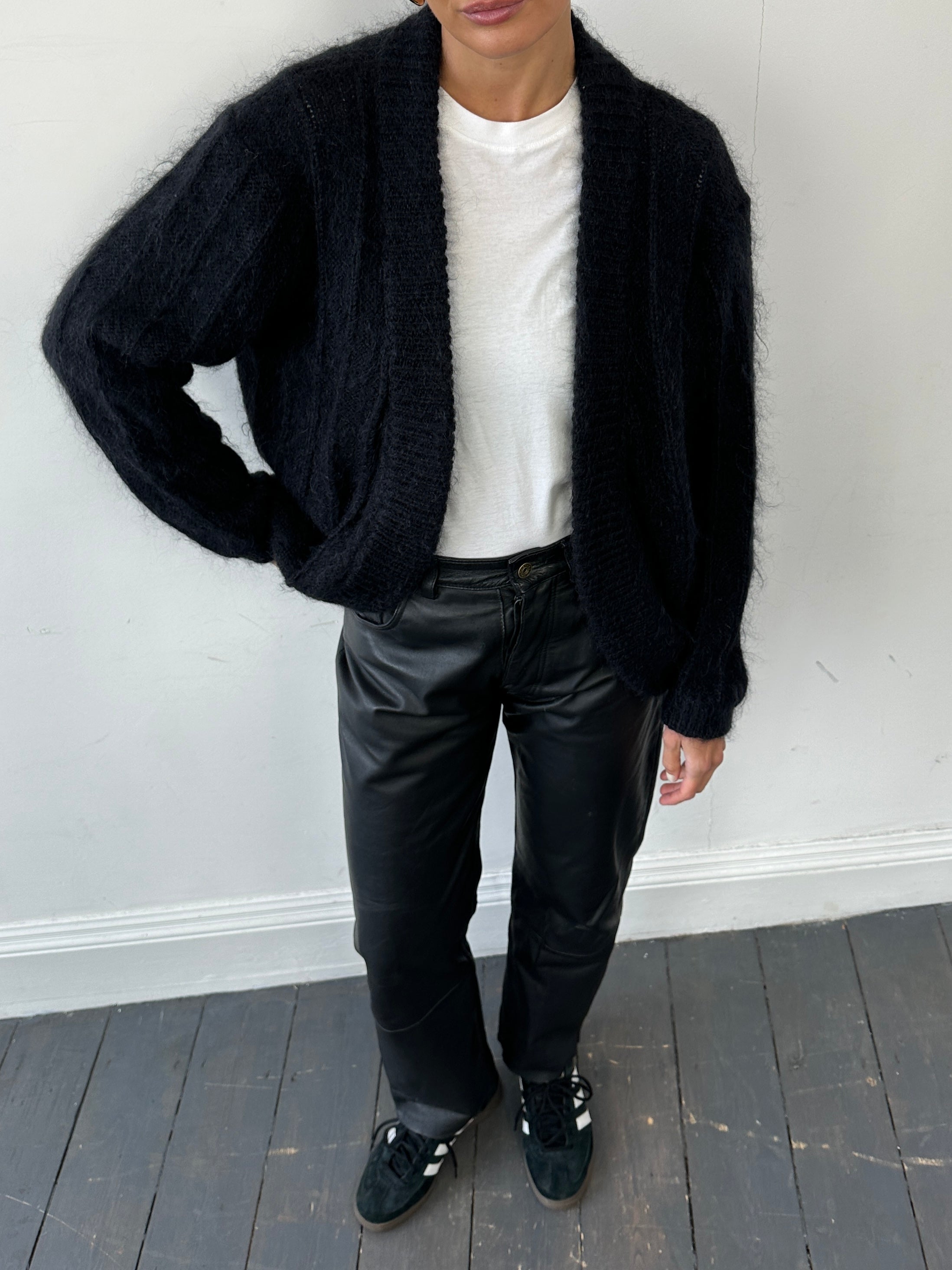 Vintage mohair knitted cardigan in size M, featuring a cozy, textured knit with a classic design and button closure.
