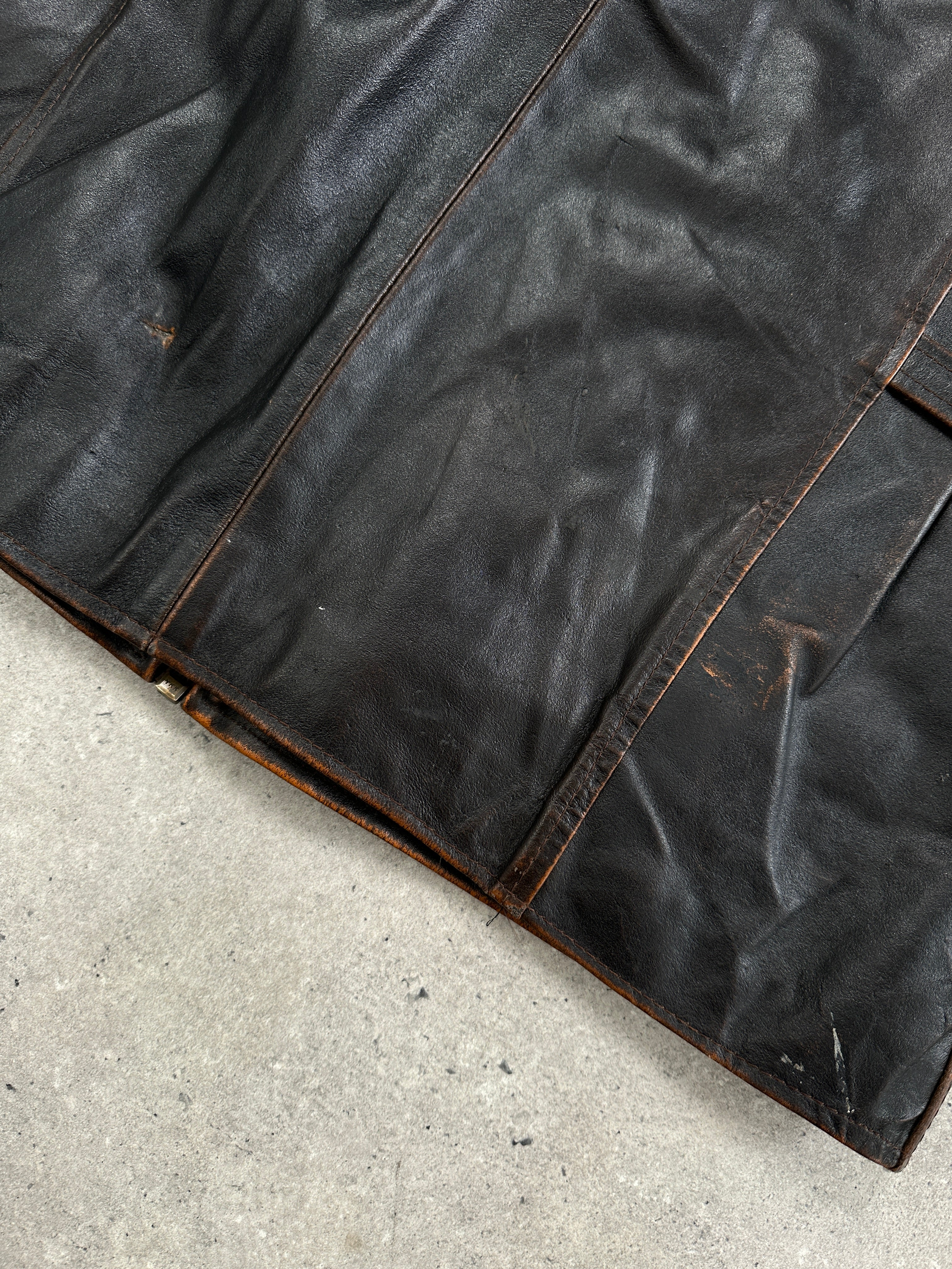 Italian vintage 1990s distressed leather jacket, large/extra-large size, showing rugged leather with worn, stylish detailing.
