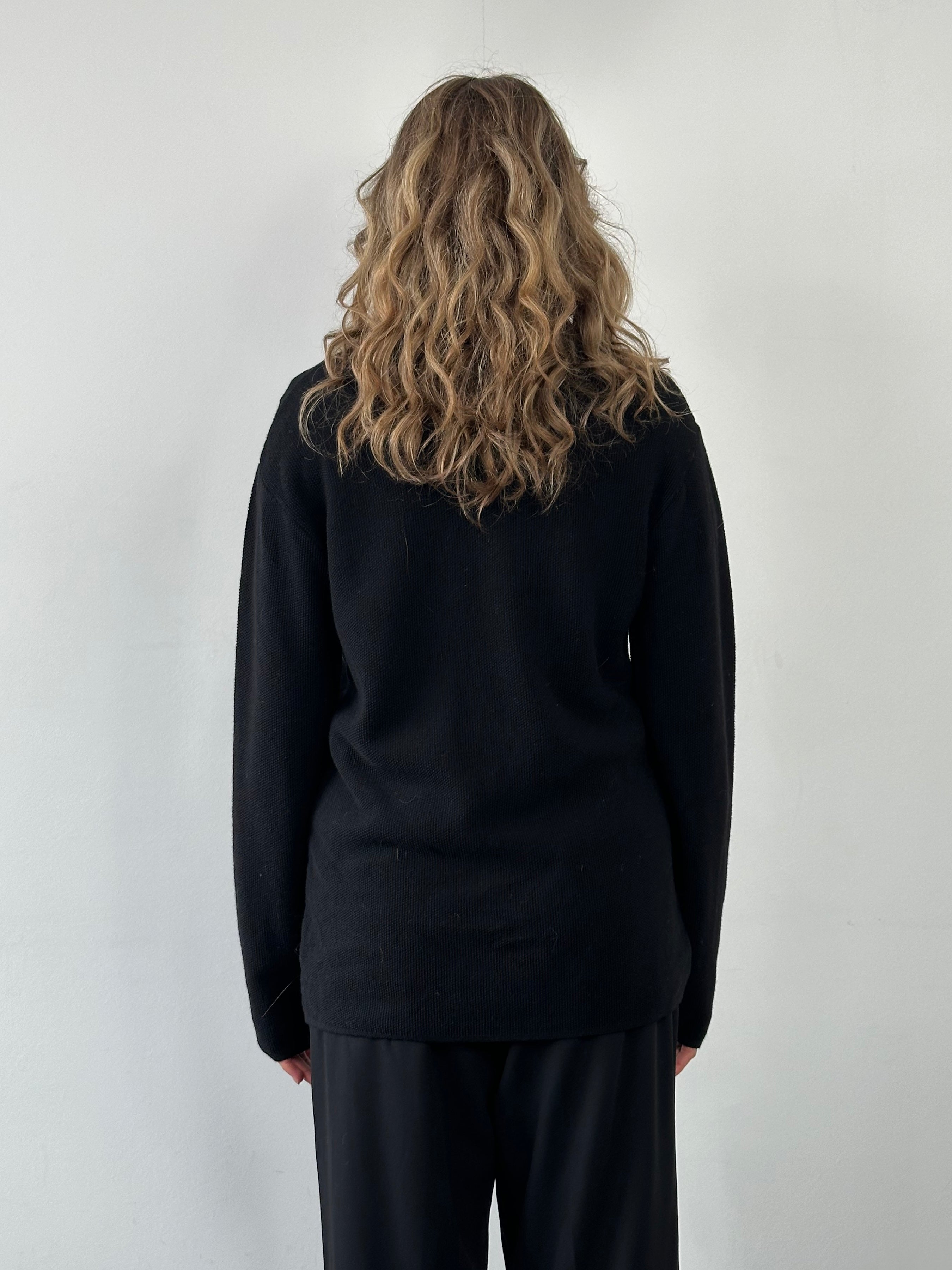 Emporio Armani pure wool knitted jumper in size M/L featuring a classic design and soft, textured fabric.