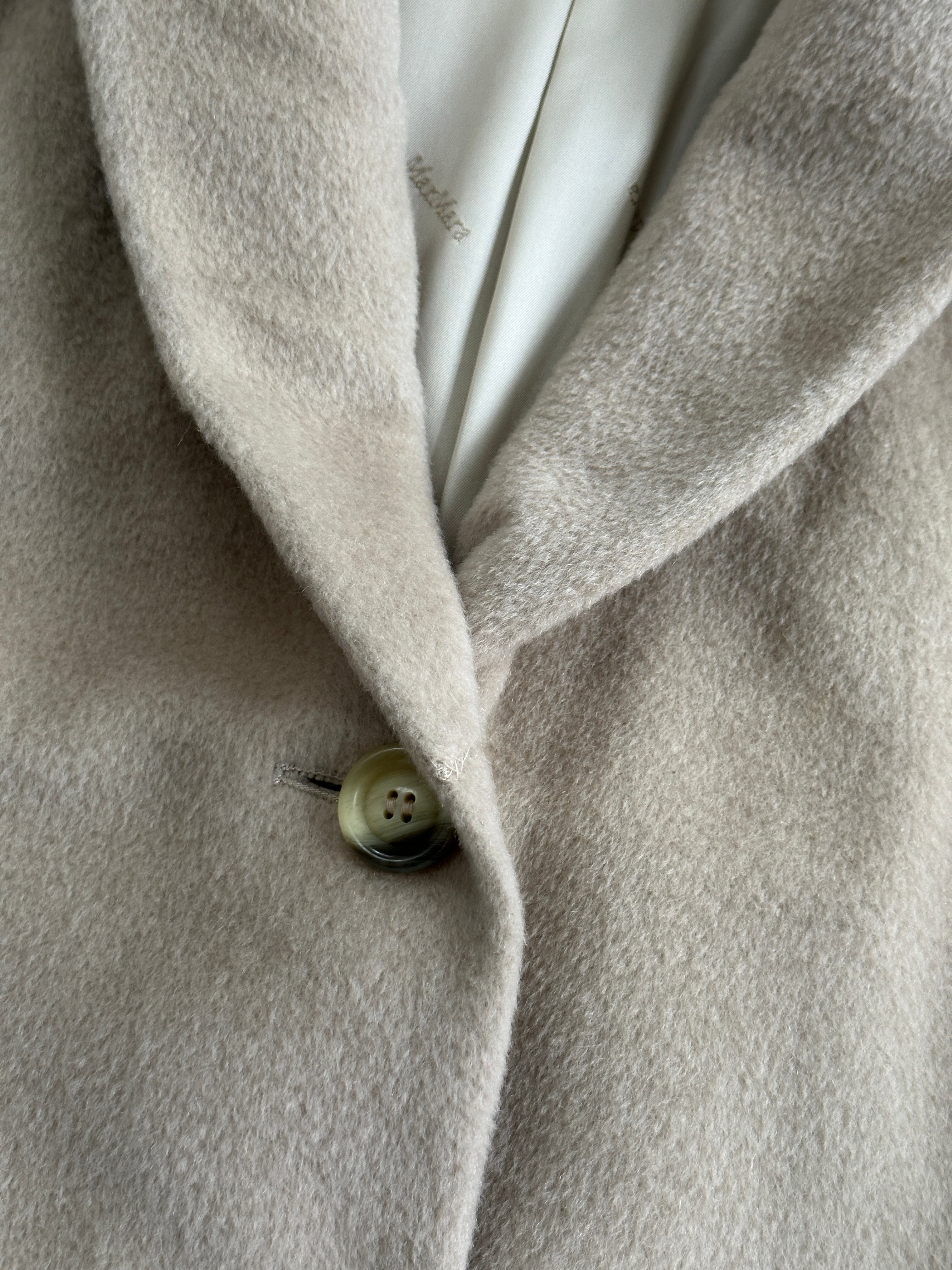 Max Mara brushed wool and cashmere single-breasted coat in M/L size, showcasing its elegant tailored design and warm fabric.