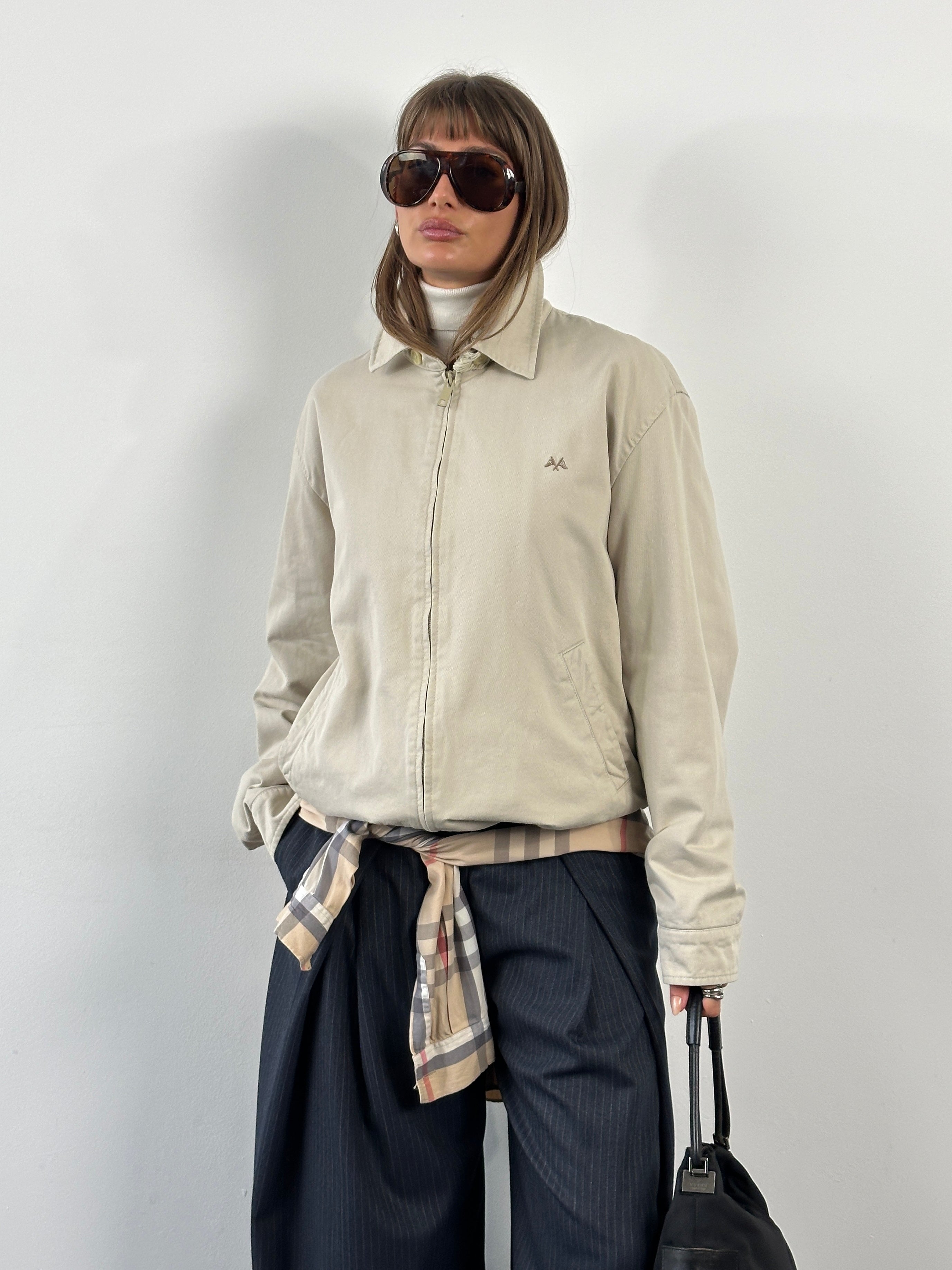 Burberry Thomas 1990s cotton Harrington bomber jacket in XL, featuring classic design and dark color, displayed on a hanger.
