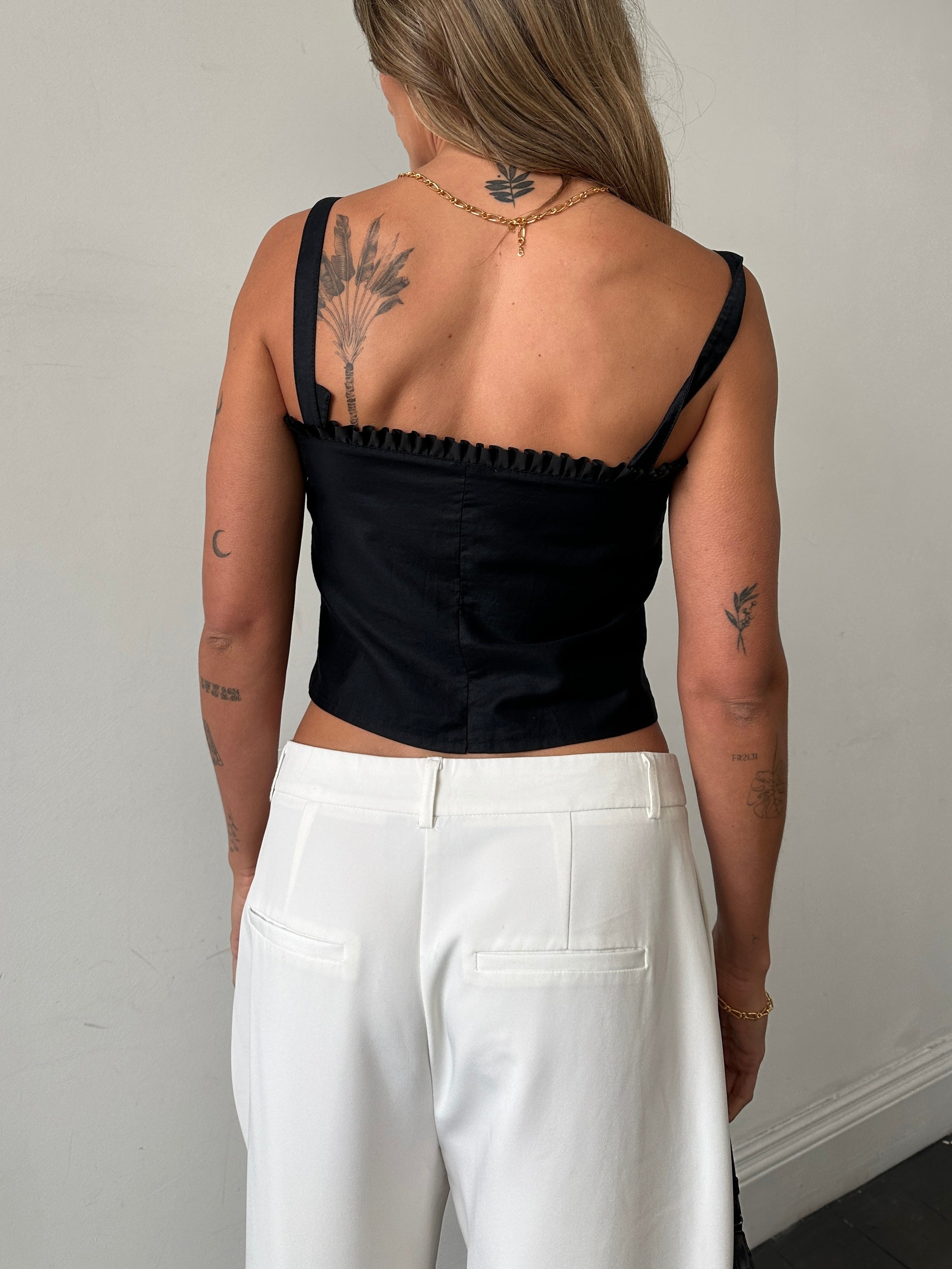 Vintage brand vintage frill trim crop top in size small, featuring a delicate ruffle detail and a stylish cropped silhouette.