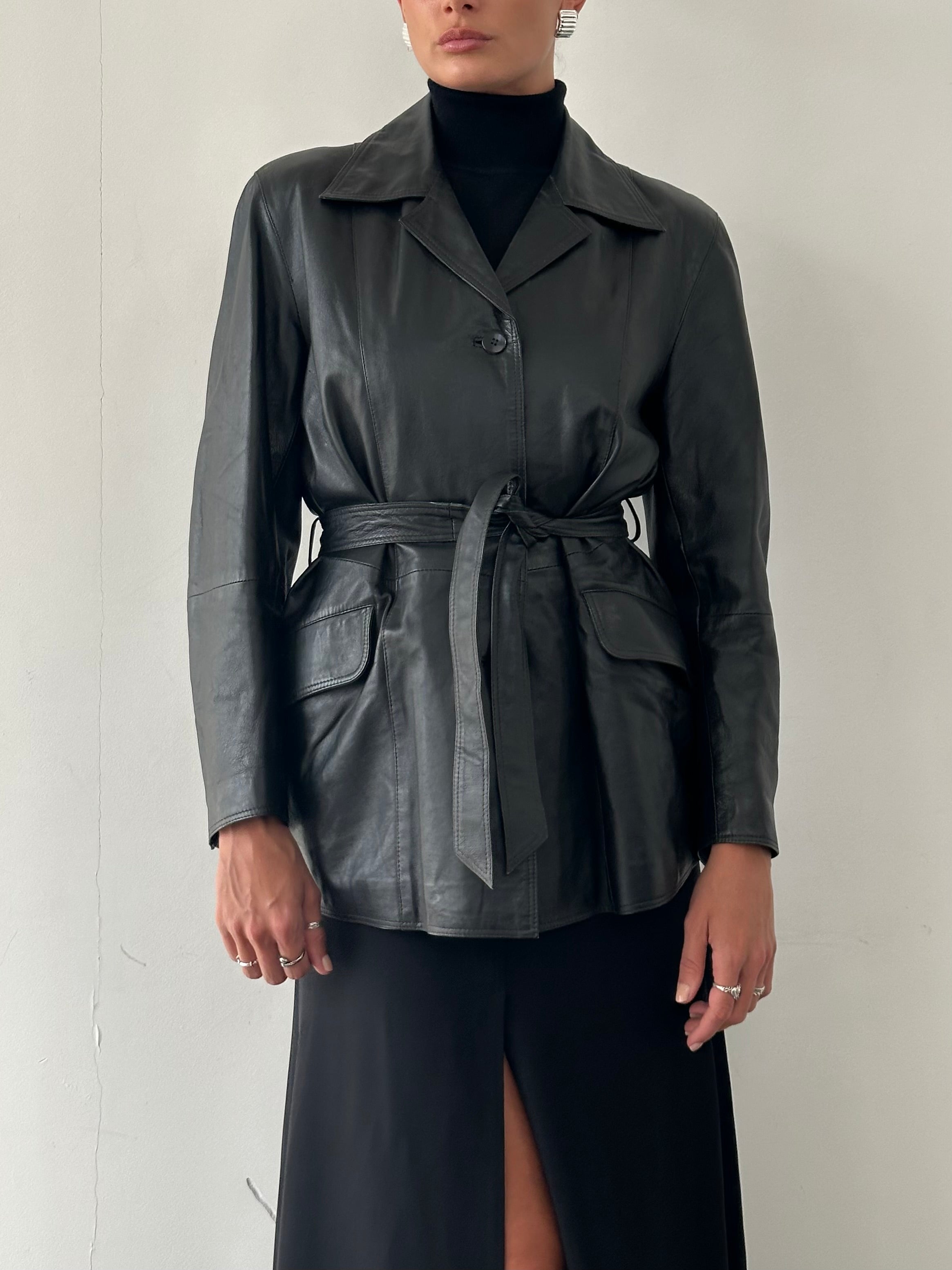 Conbipel belted leather jacket in size M, featuring a classic design with a front belt and smooth leather finish.