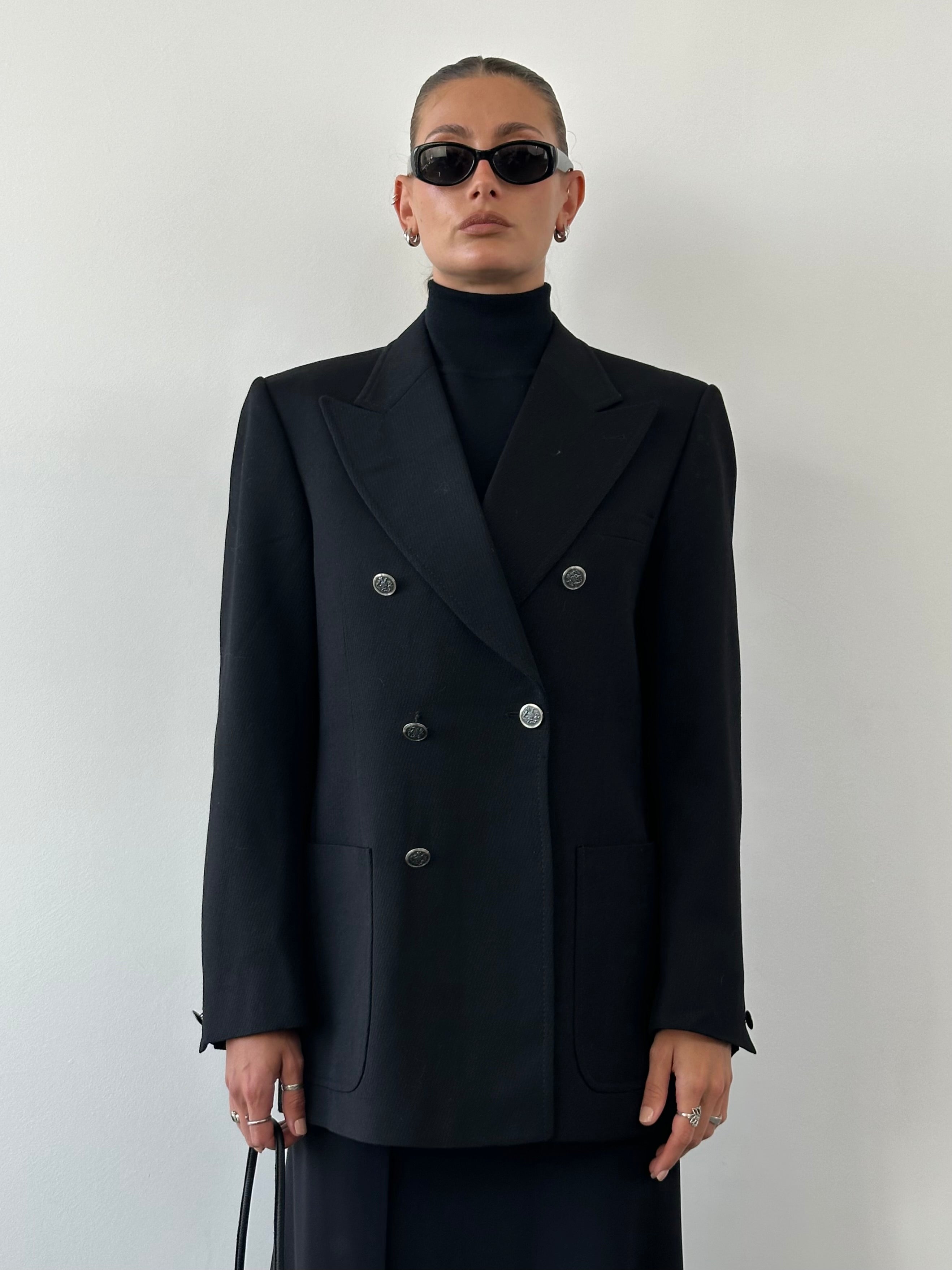 Vintage wool double-breasted blazer in size L, featuring classic tailoring and button details, on a plain background.