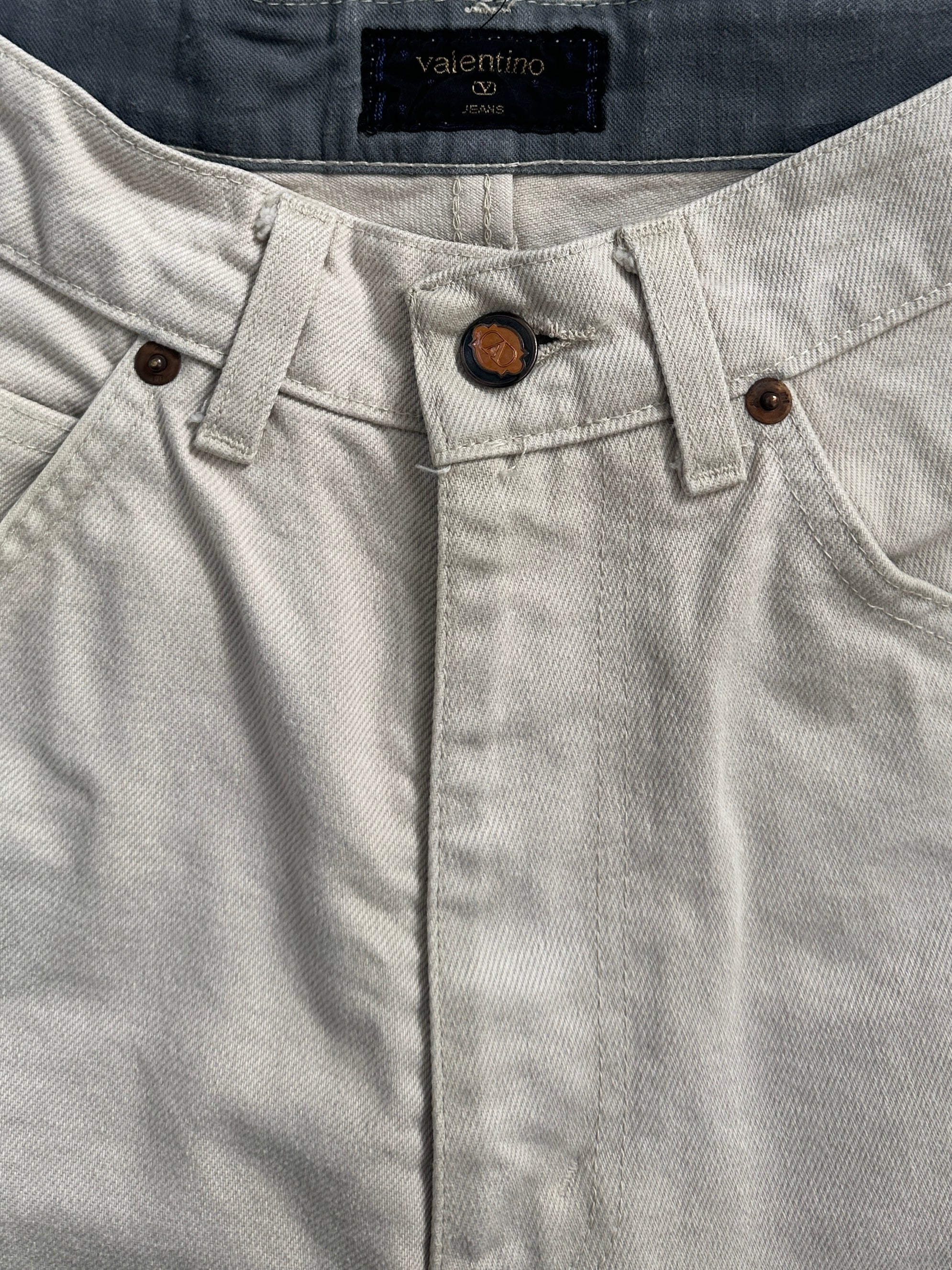 Valentino pure cotton high-waisted denim jeans in size W26, featuring classic blue wash and fitted style.