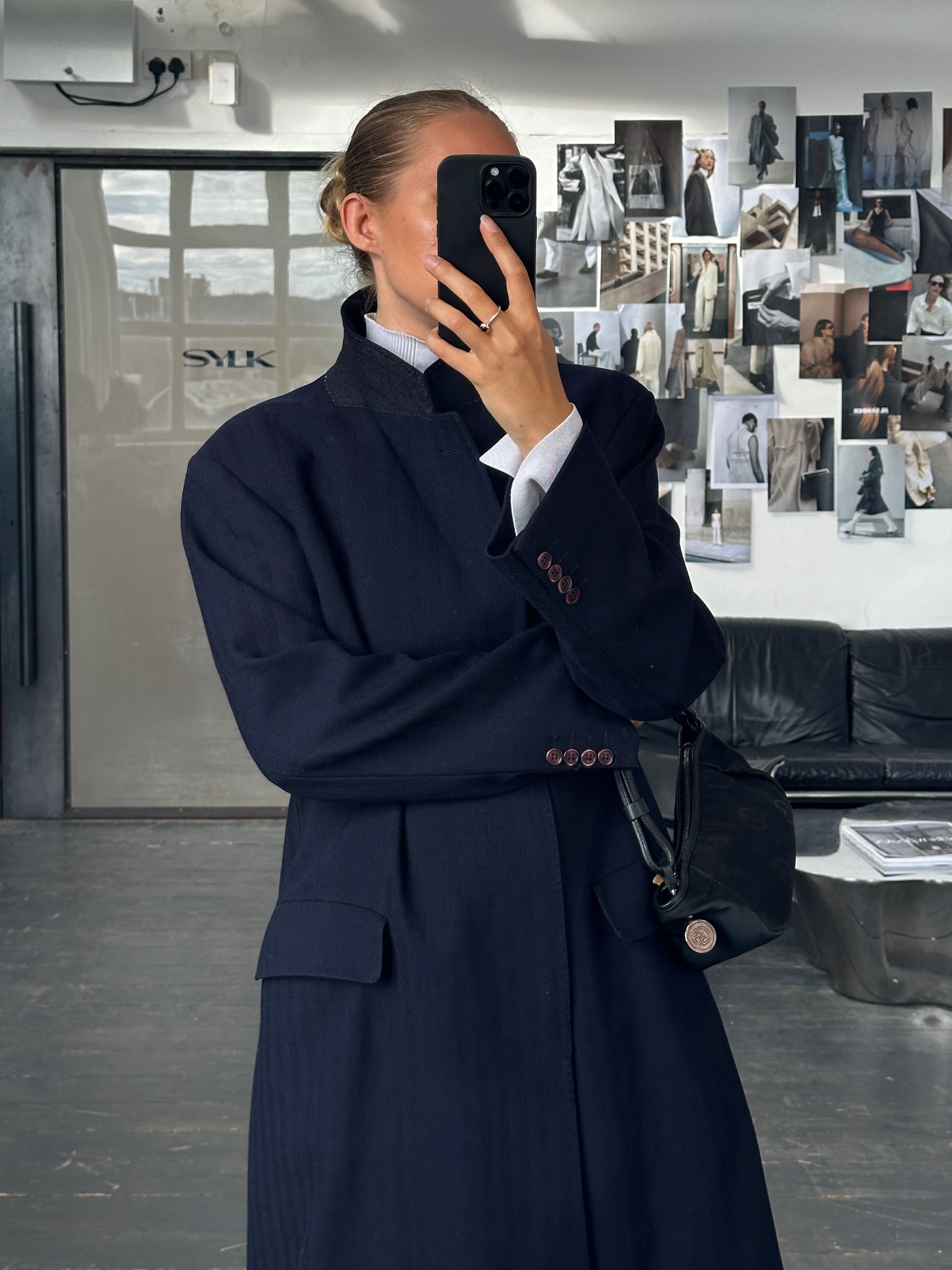Christian Dior 1990s XL pure wool coat with concealed placket, tailored and elegant, shown on a neutral background.