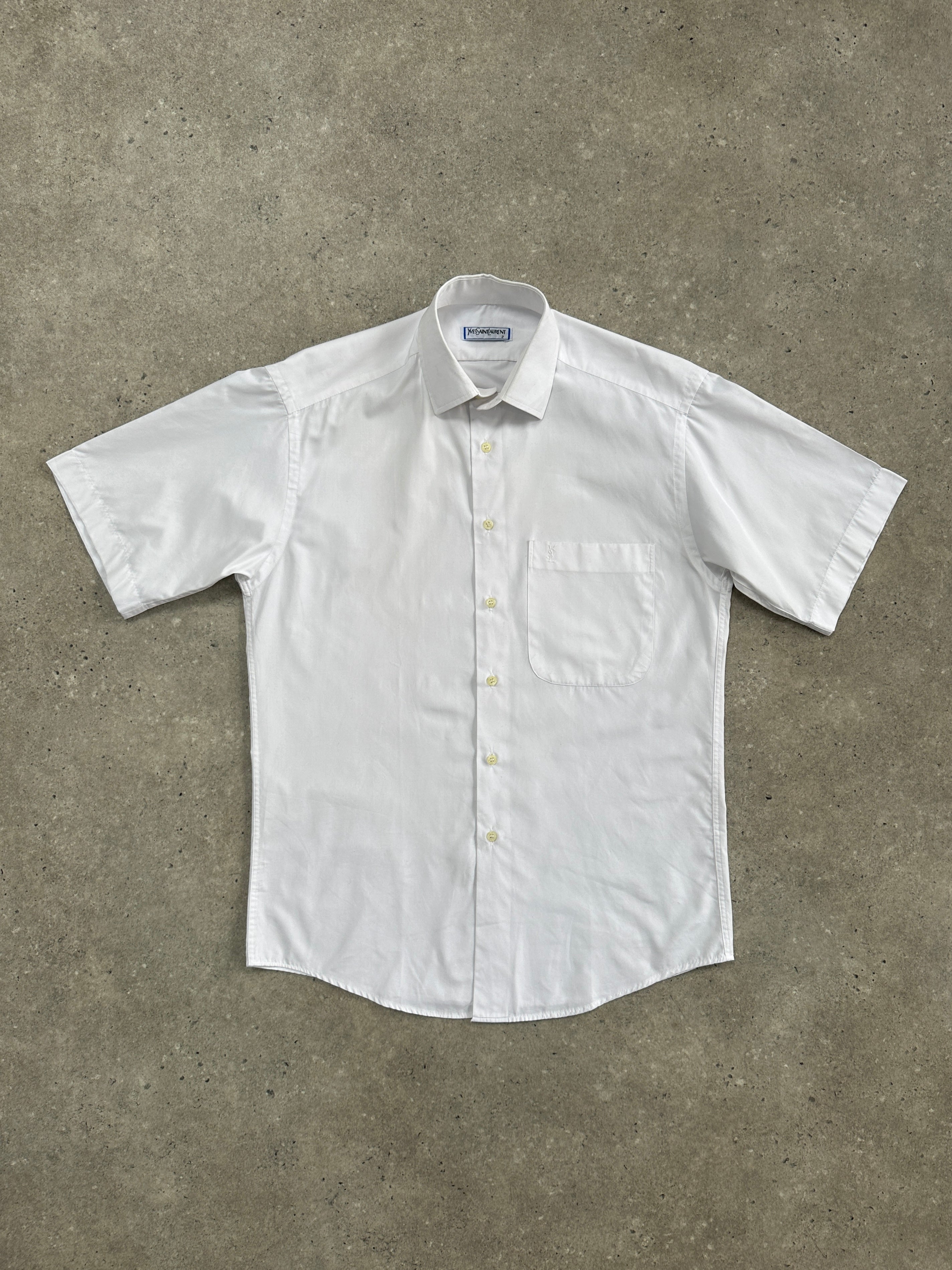 Yves Saint Laurent 1980s logo cotton short sleeve shirt in black and white, featuring classic YSL branding and a relaxed fit.