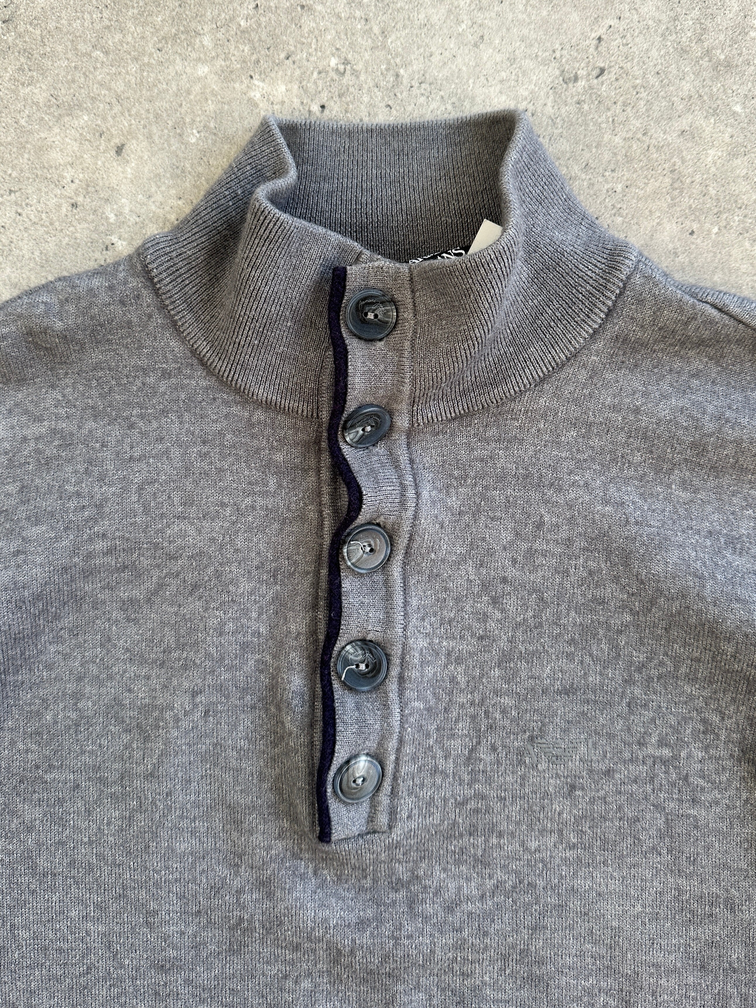 Armani Jeans 1990s wool knitted jumper with button neck in black, featuring a cozy, vintage 1990s style for casual wear.