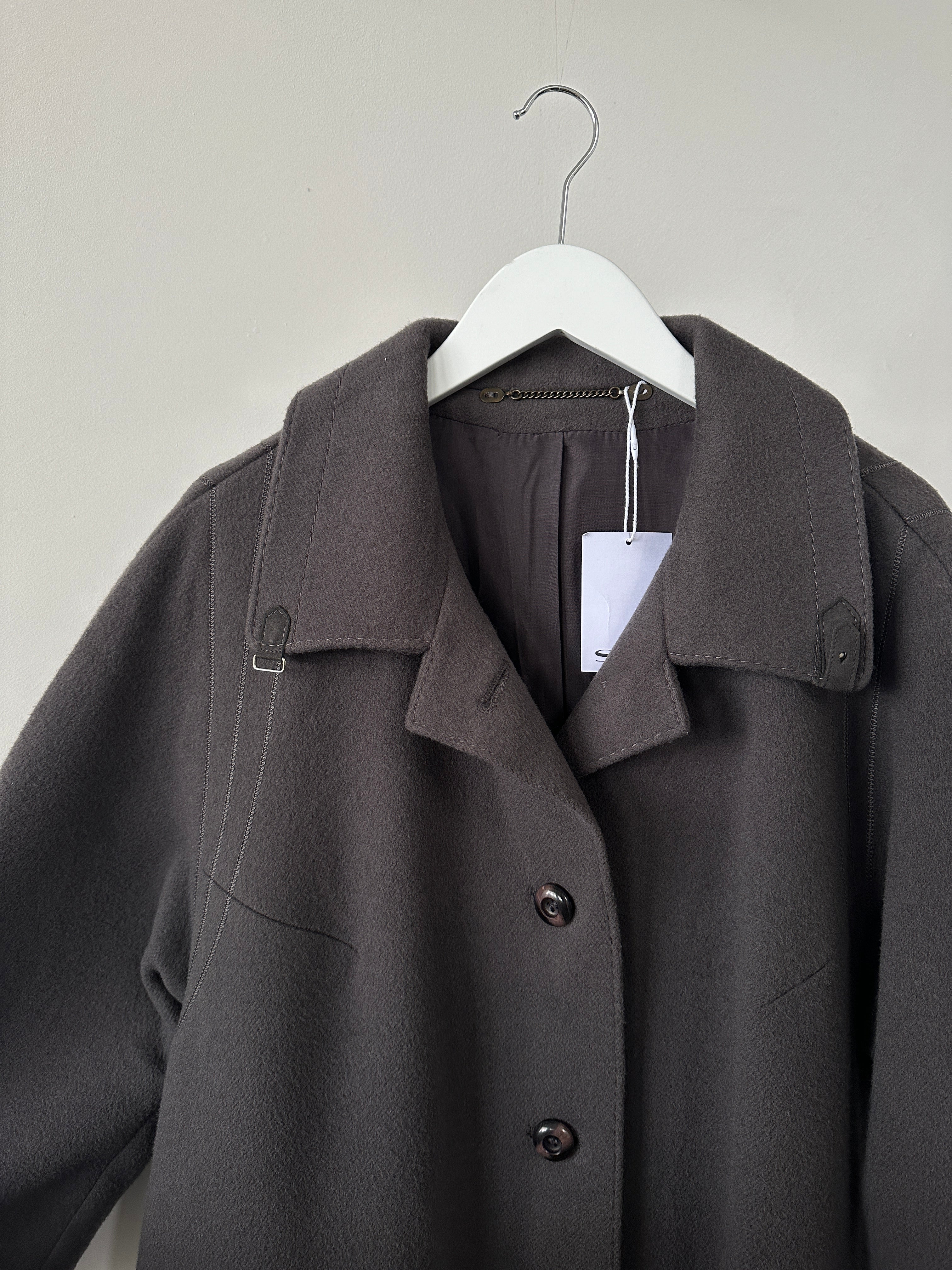 Vintage brand wool single-breasted coat in size M, showcasing classic design and textured fabric.
