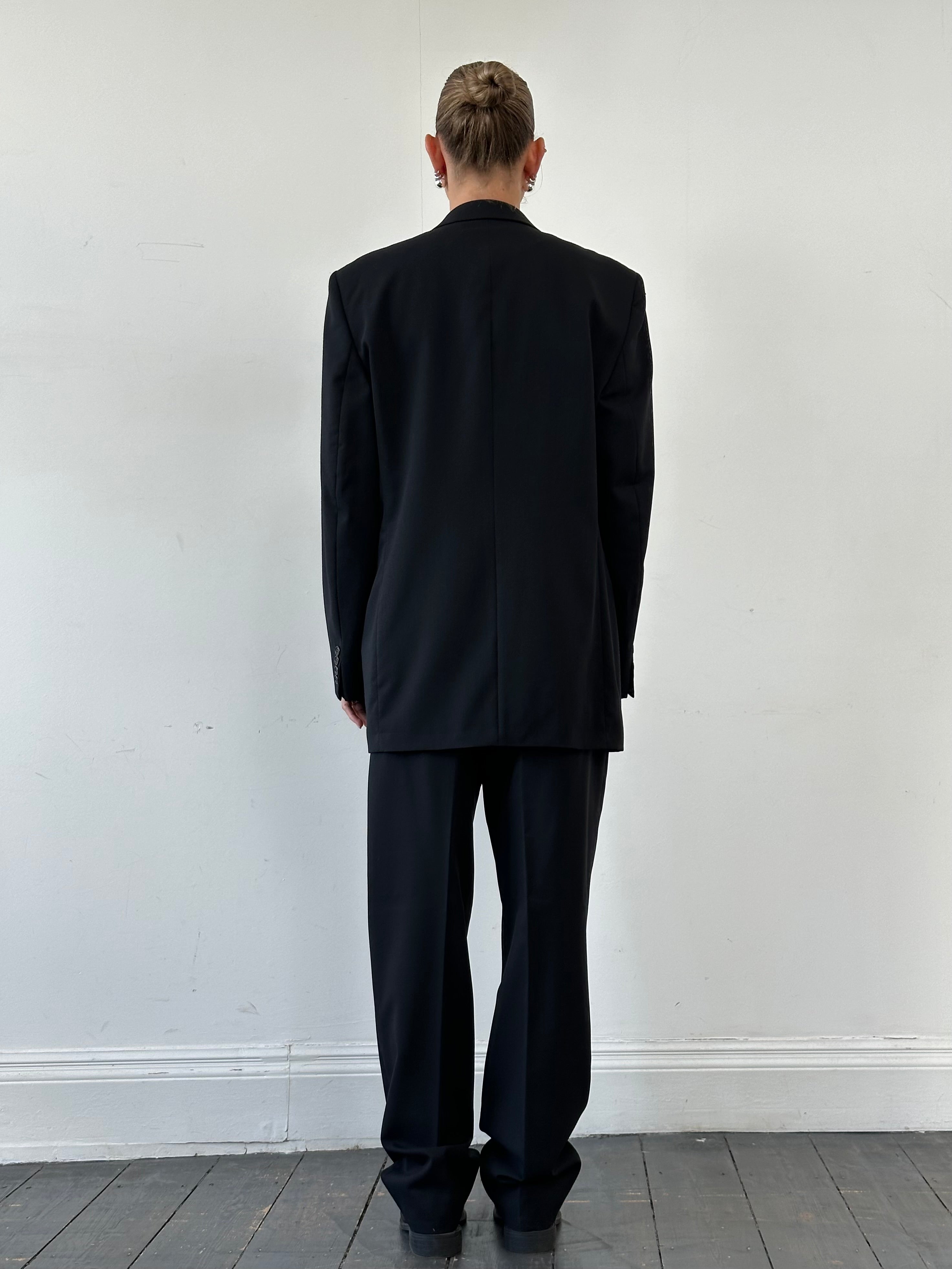 Yves Saint Laurent Pour Homme pure wool three-piece suit in size 40L/W32, tailored and stylish, displayed on a mannequin.