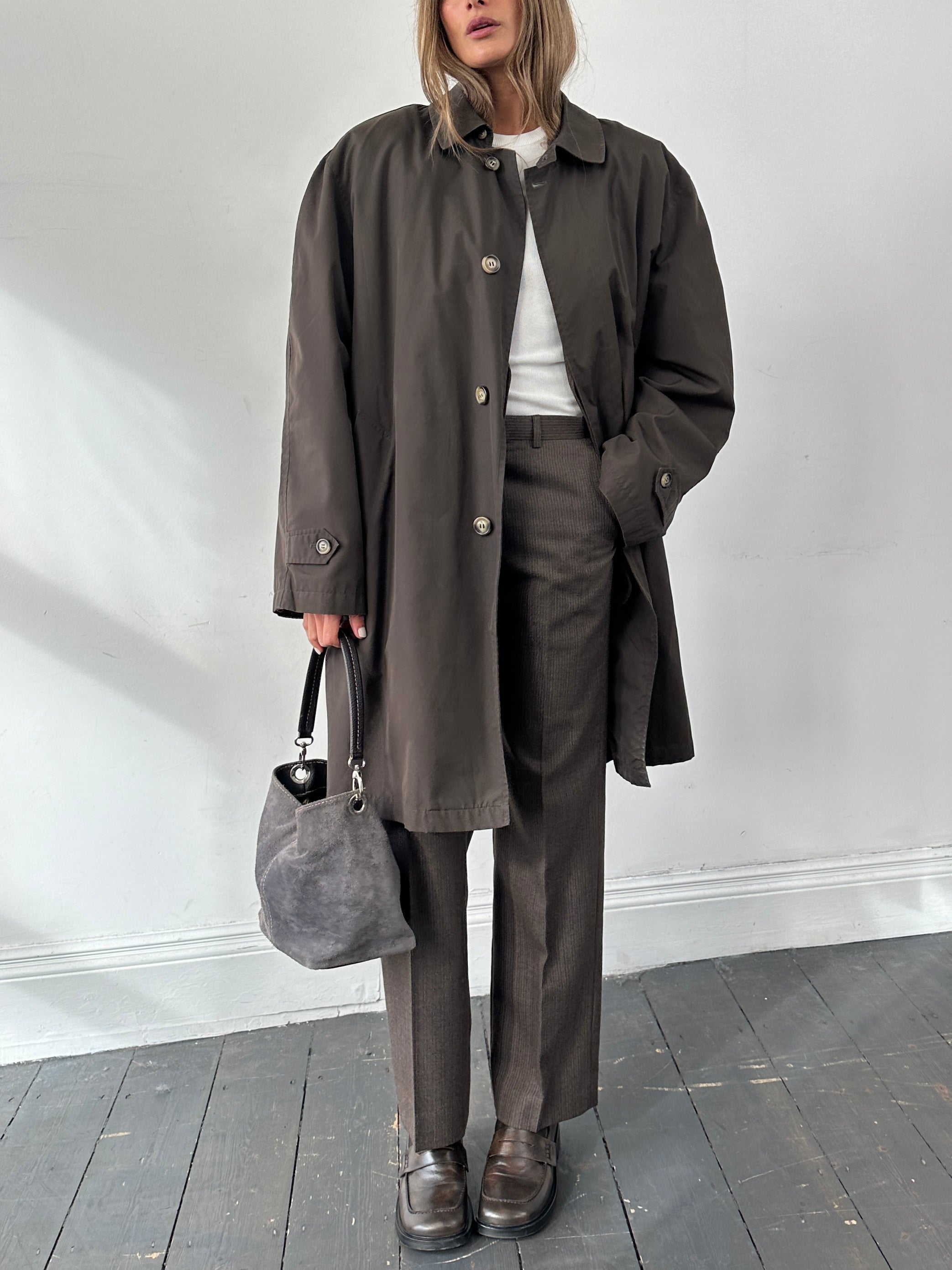 Vintage vintage concealed placket trench coat in XXL, showing classic design and button details on front.
