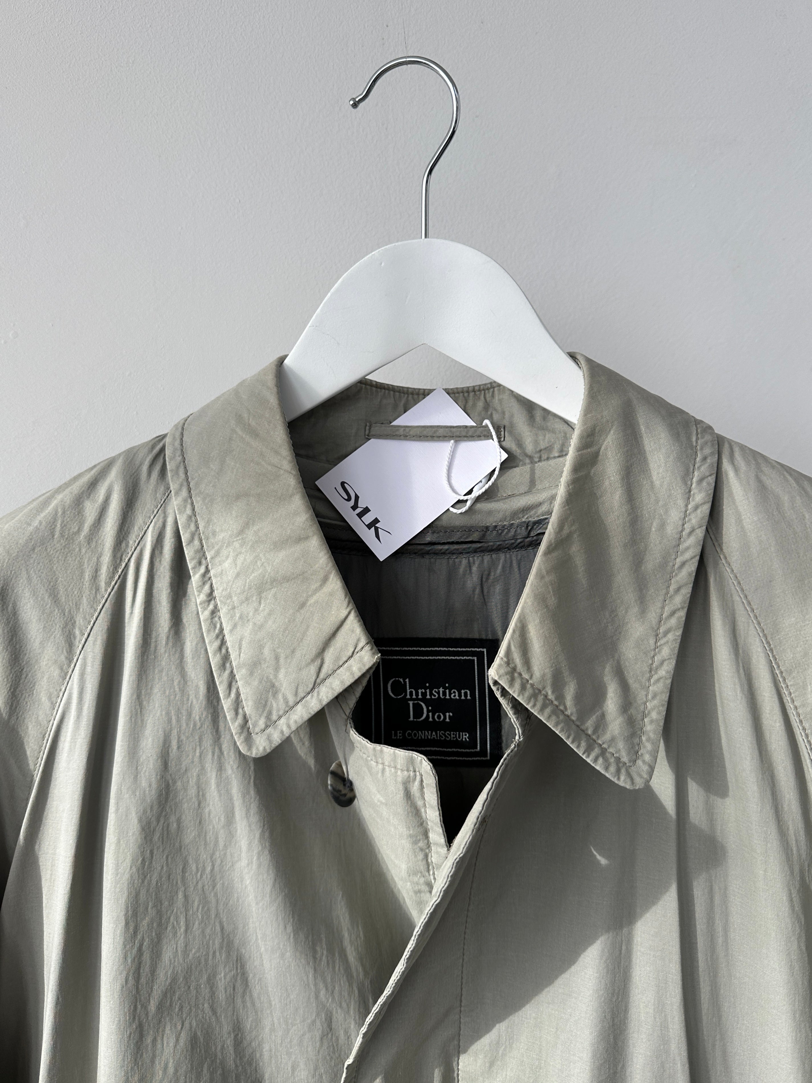 Christian Dior Le Connaisseur belted trench coat in size M, beige fabric with classic collar and button details.