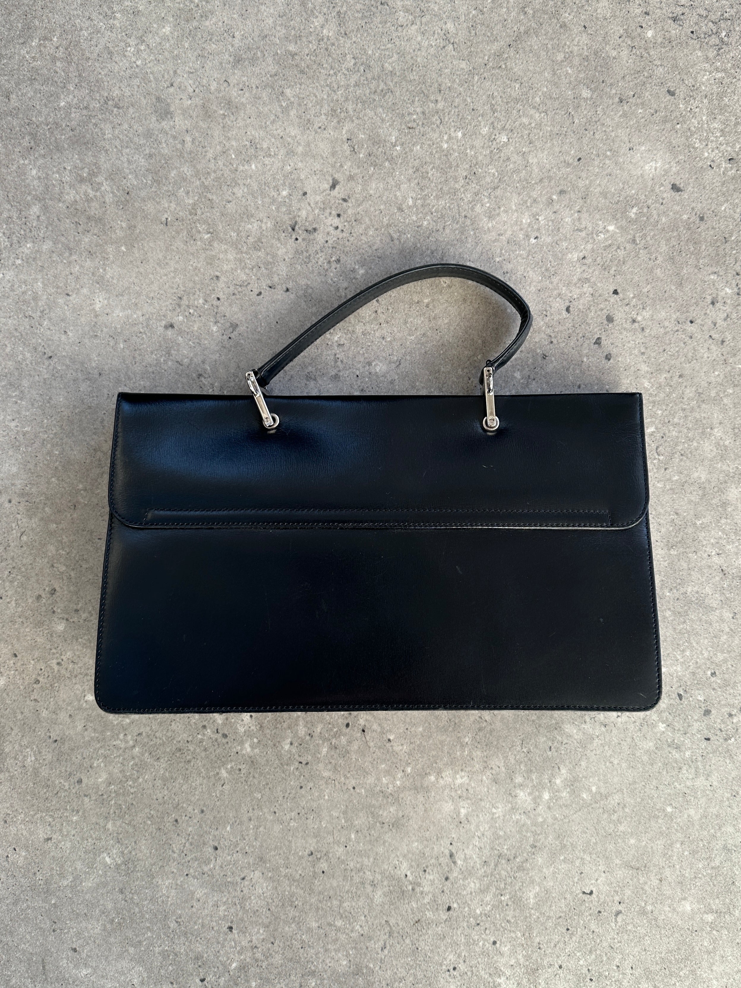 Gucci 1990s Tom Ford Square G leather handbag with structured design and gold-tone hardware, featuring the iconic GG logo.