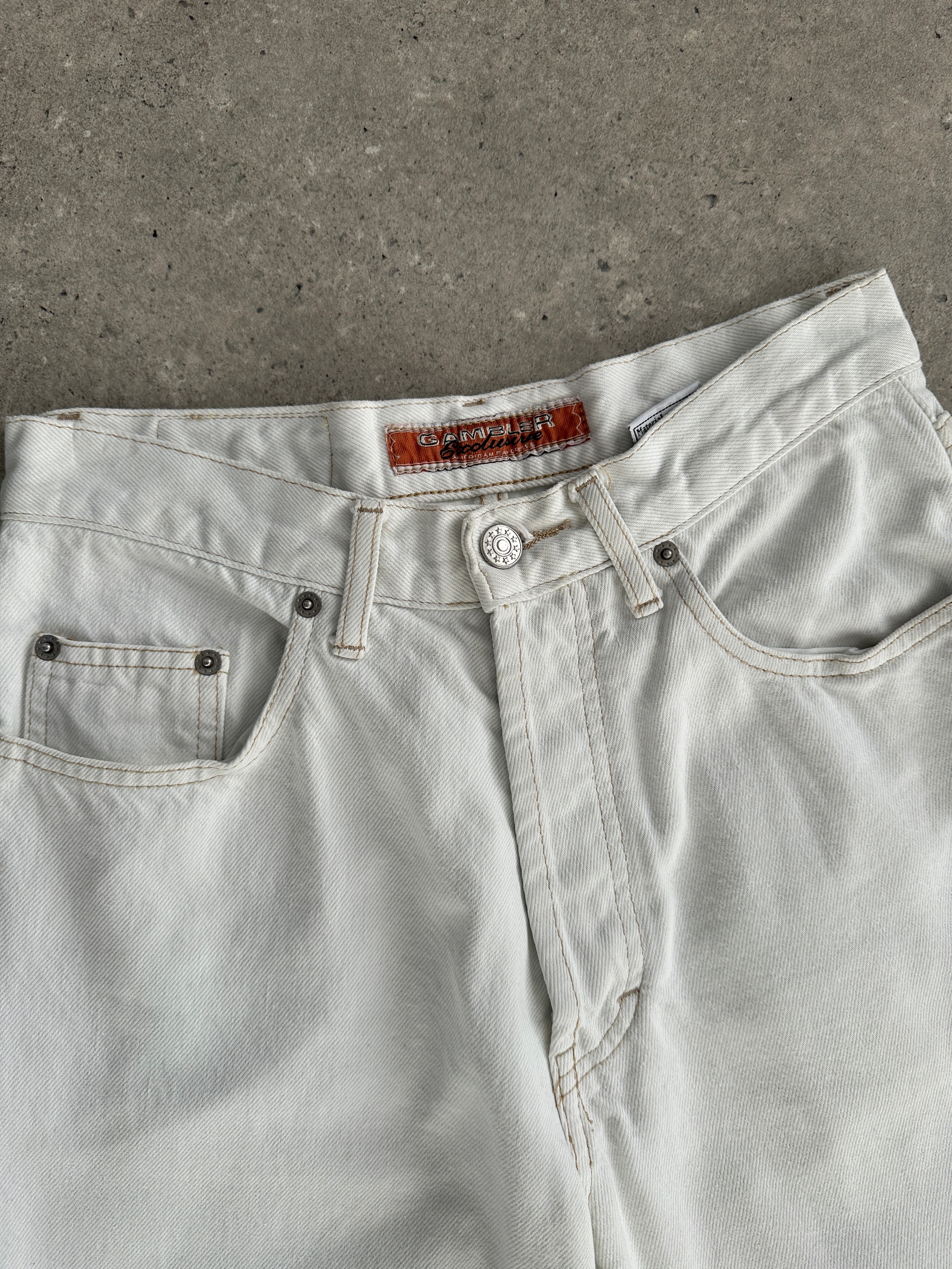 Vintage denim straight leg jeans in size W26, showing classic blue color and five-pocket design on a white background.