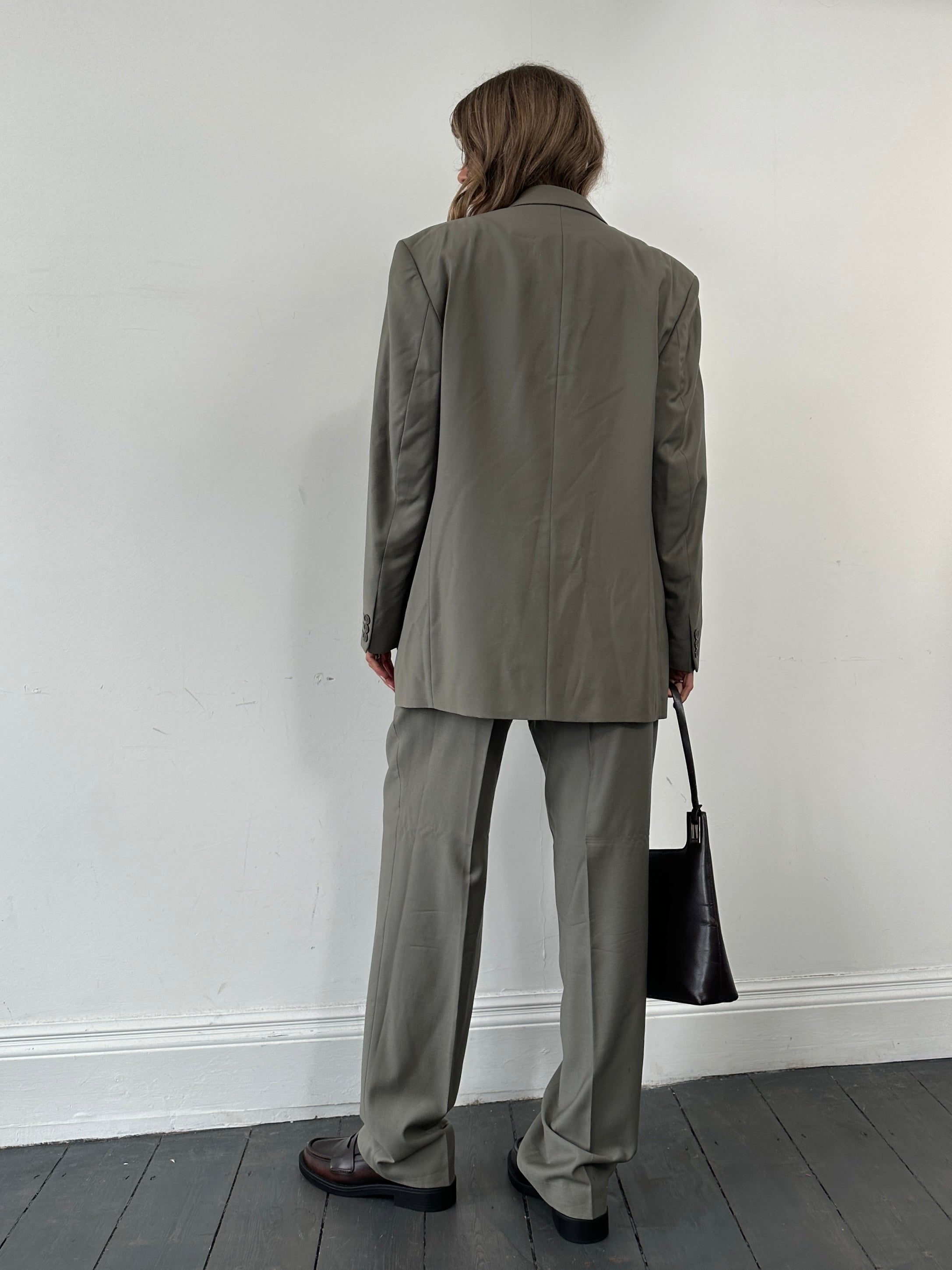 Pierre Cardin pure wool single-breasted suit jumpsuit in size 40R/W33, tailored fit with classic lapel and front button closure.