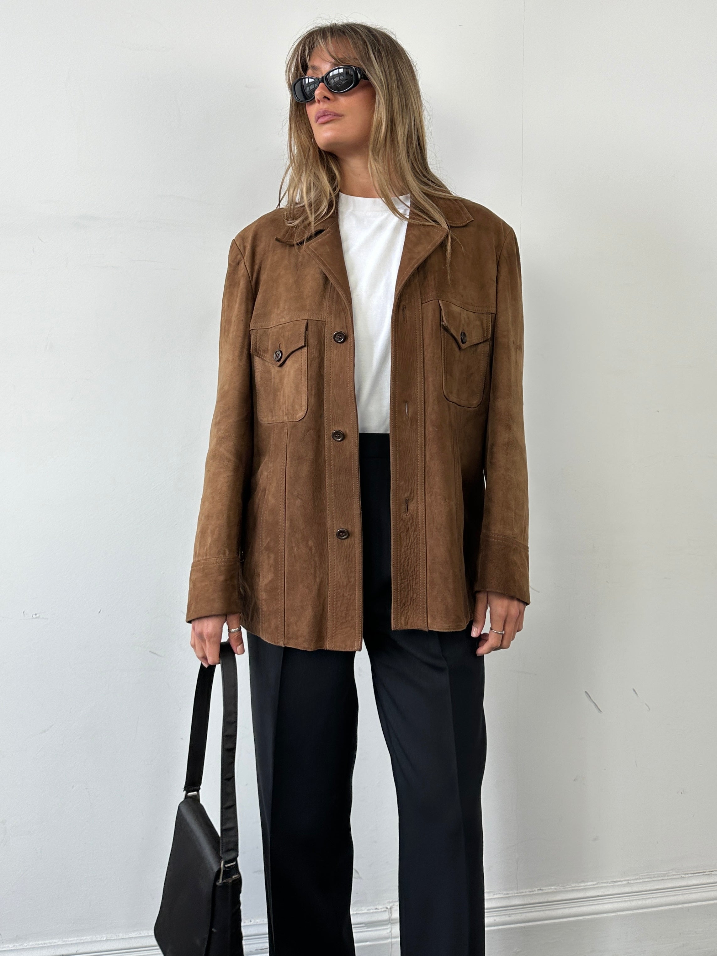 Vintage British 70s suede leather trucker jacket in size large, featuring classic design and authentic vintage detailing.