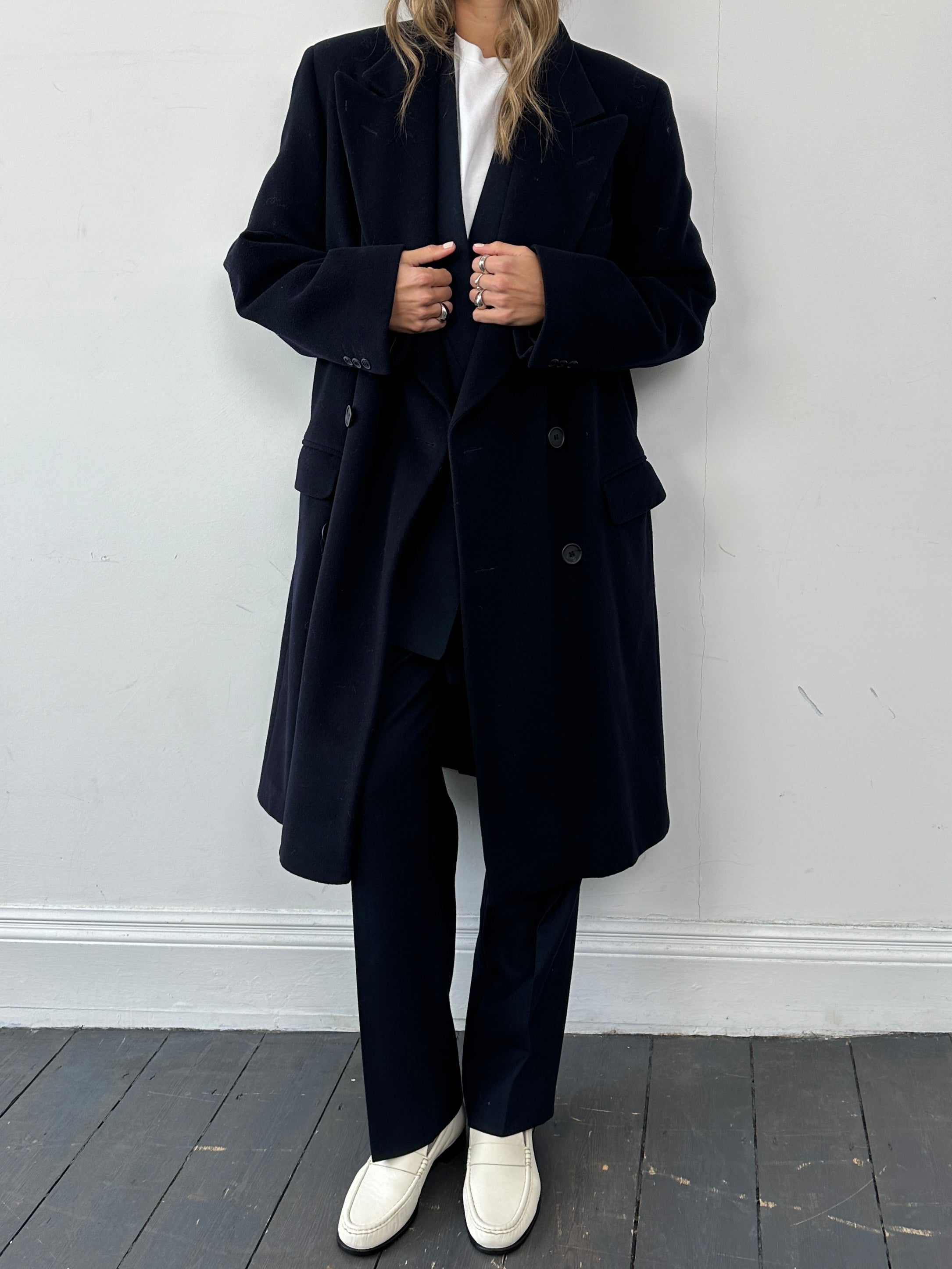 Giorgio Armani pure wool double-breasted coat in size L, shown in a classic style with a tailored fit and lapel collar.